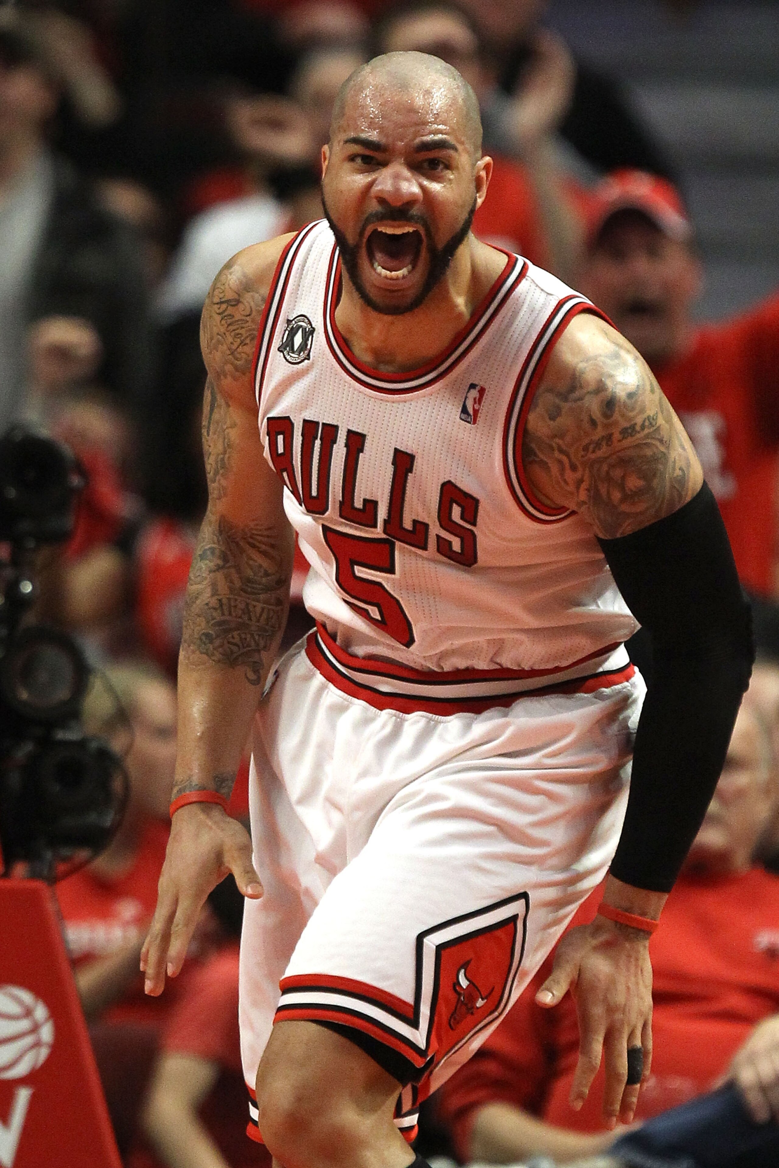 CHICAGO, IL - MAY 15:  Carlos Boozer #5 of the Chicago Bulls reacts against the Miami Heat in Game One of the Eastern Conference Finals during the 2011 NBA Playoffs on May 15, 2011 at the United Center in Chicago, Illinois. NOTE TO USER: User expressly ac