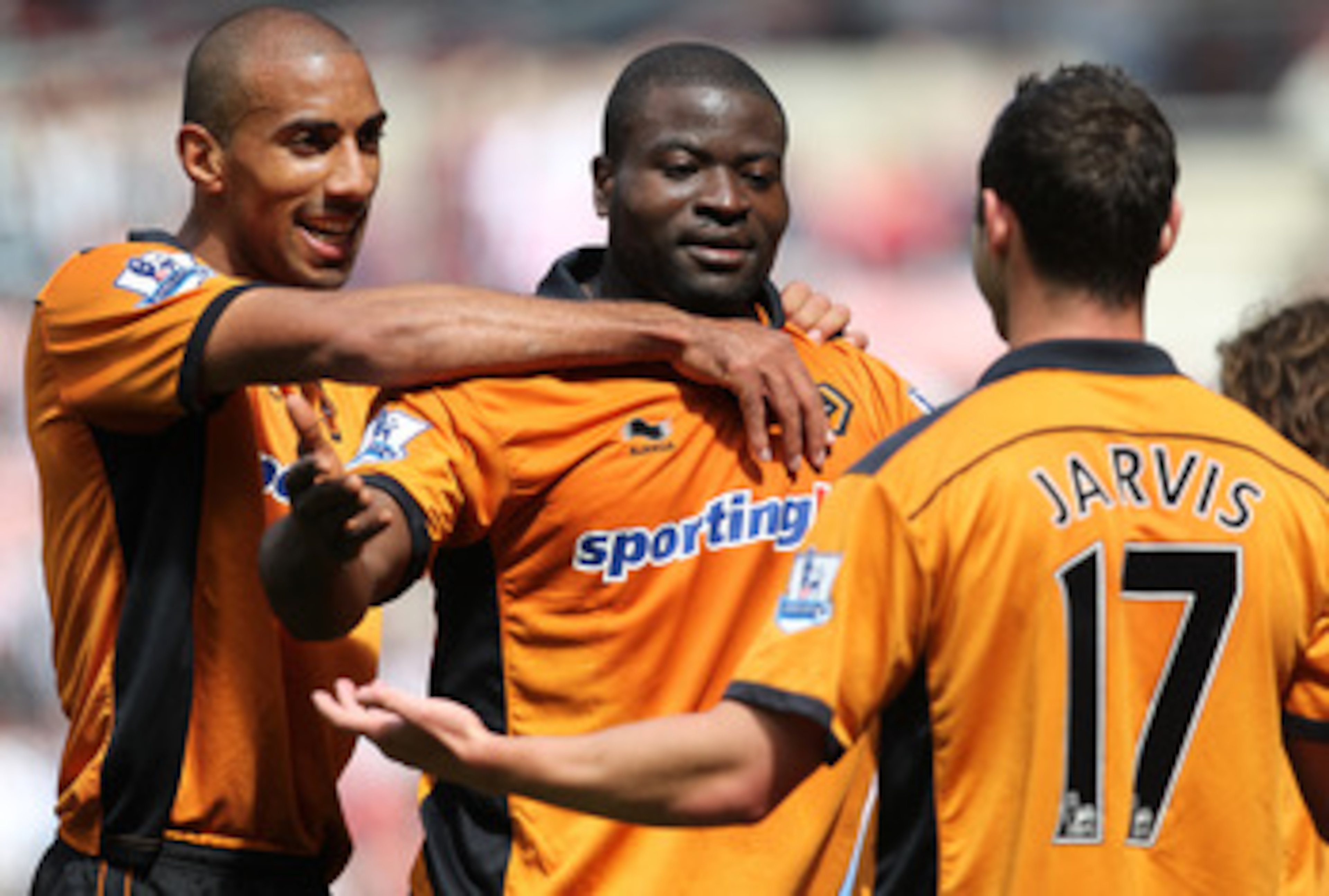 SUNDERLAND, ENGLAND - MAY 14:   George Elokobi of Wolverhampton Wanderers (centre) celebrates his goal during the Barclays Premier League match between Sunderland and Wolverhampton Wanderers at The Stadium of Light on May 14, 2011 in Sunderland, England. 