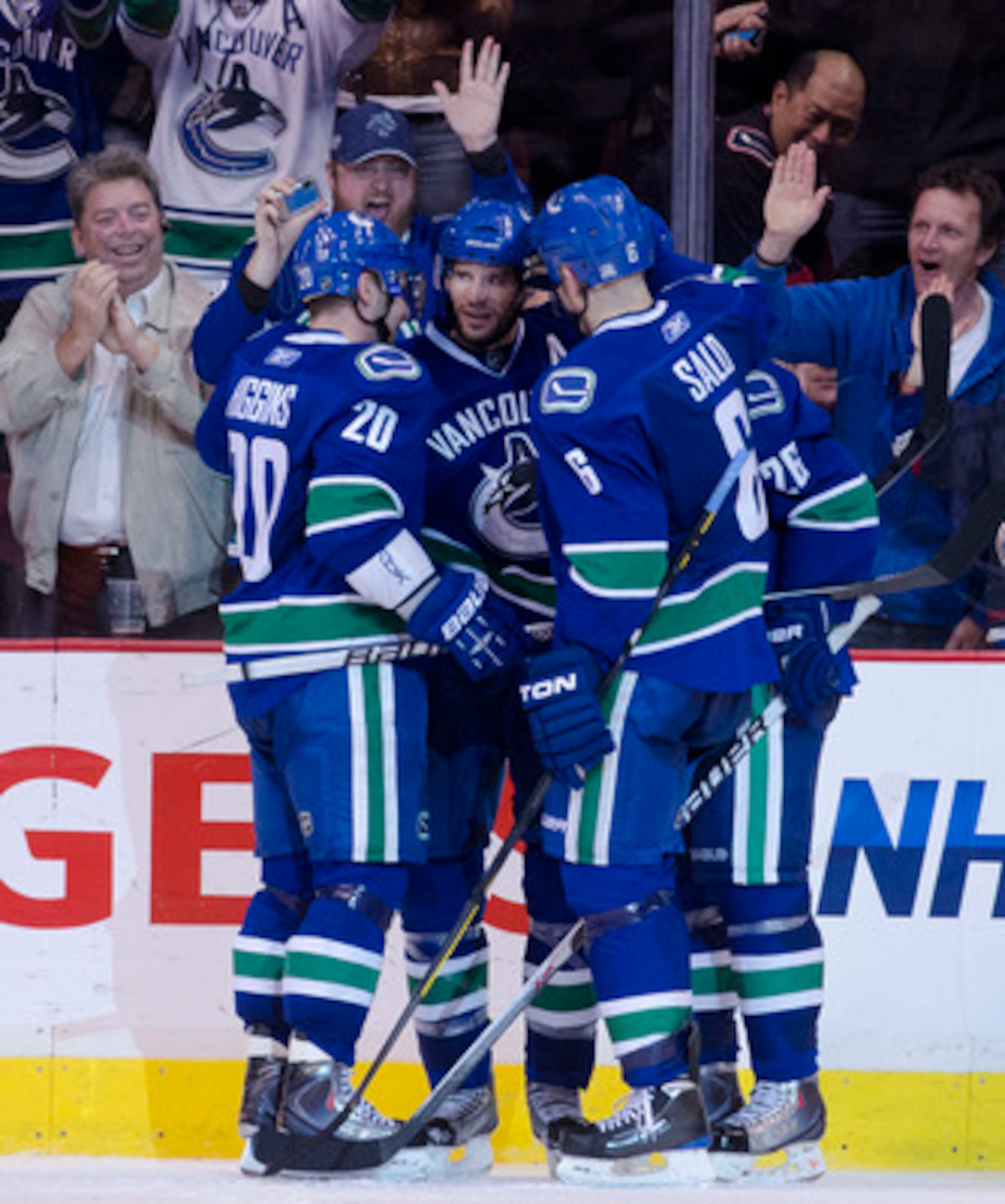 VANCOUVER, CANADA - APRIL 7: Ryan Kesler #17 of the Vancouver Canucks is congratulated by teammates Chris Higgins #20, Sami Salo #6 and Mikael Samuelsson #26 after scoring his third goal of the game against the Minnesota Wild during the third period in NH VANCOUVER, CANADA - APRIL 7: Ryan Kesler #17 of the Vancouver Canucks is congratulated by teammates Chris Higgins #20, Sami Salo #6 and Mikael Samuelsson #26 after scoring his third goal of the game against the Minnesota Wild during the third period in NH