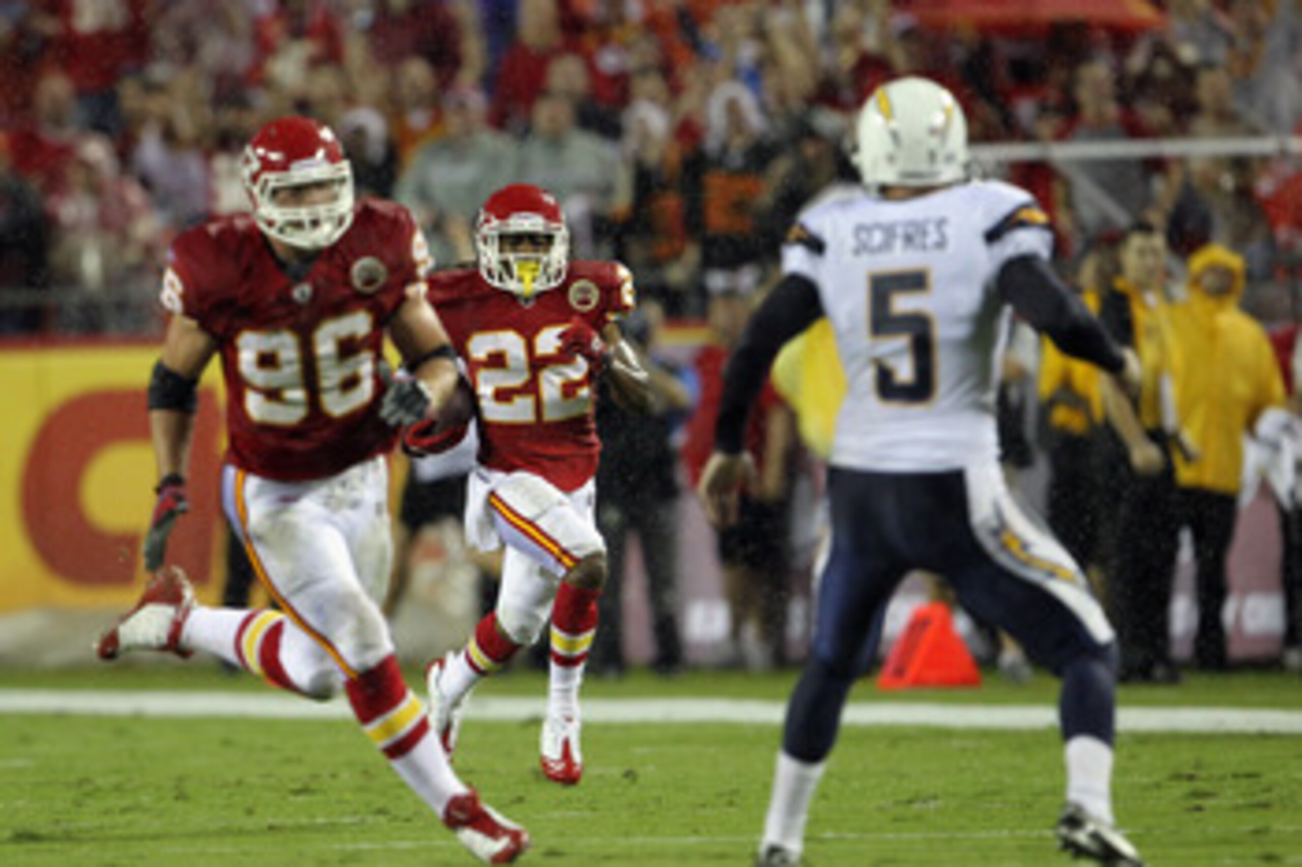 KANSAS CITY, MO - SEPTEMBER 13:  Dexter McCluster #22 of the Kansas City Chiefs returns a punt for a touchdown as punter Mike Scifres #5 of the San Diego Chargers defends during the 1st half of the game against on September 13, 2010 at Arrowhead Stadium i