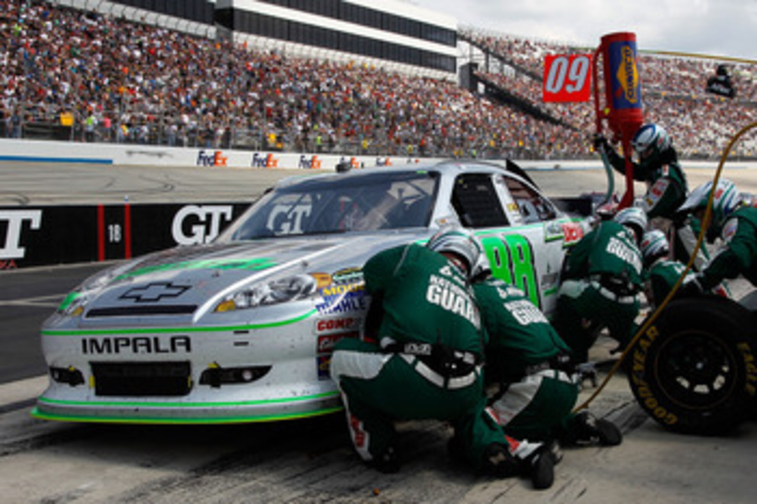 DOVER, DE - MAY 15:  Dale Earnhardt Jr., driver of the #88 AMP Energy Sugar-Free/National Guard Chevrolet, comes in for a pit stop during the NASCAR Sprint Cup Series FedEx 400 Benefiting Autism Speaks at Dover International Speedway on May 15, 2011 in Do