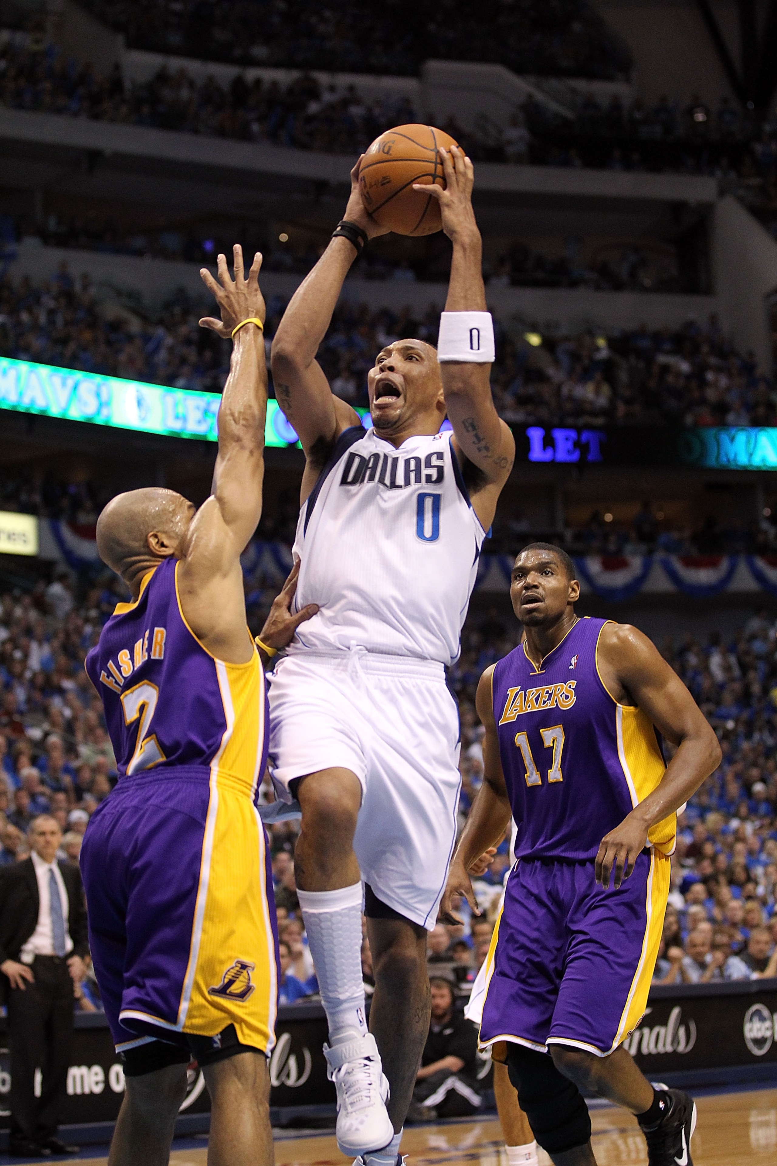 DALLAS, TX - MAY 08:  Forward Shawn Marion #0 of the Dallas Mavericks takes a shot against Derek Fisher #2 of the Los Angeles Lakers in Game Four of the Western Conference Semifinals during the 2011 NBA Playoffs on May 8, 2011 at American Airlines Center