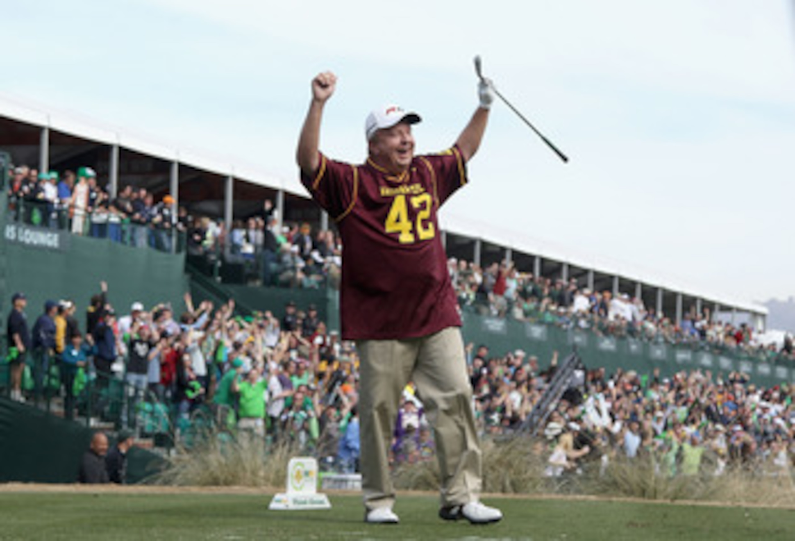 SCOTTSDALE, AZ - FEBRUARY 05:  Billy Mayfair, wearing a #42 Pat Tillman ASU Sun Devils jersey, celebrates after his tee shot on the 16th hole during the second round of the Waste Management Phoenix Open at TPC Scottsdale on February 5, 2011 in Scottsdale,