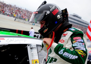 DOVER, DE - MAY 15:  Dale Earnhardt Jr., driver of the #88 Amp Energy Sugar Free/National Guard Chevrolet, stands on the grid prior to the NASCAR Sprint Cup Series FedEx 400 Benefiting Autism Speaks at Dover International Speedway on May 15, 2011 in Dover
