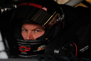 DOVER, DE - MAY 13:  Dale Earnhardt Jr., driver of the #88 Amp Energy Sugar Free/National Guard Chevrolet, sits in his car during practice for the NASCAR Sprint Cup Series FedEx 400 Benefiting Autism Speaks at Dover International Speedway on May 13, 2011