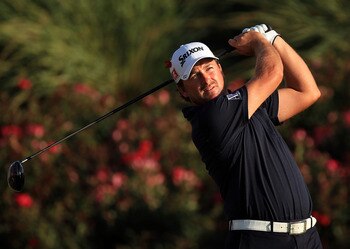 PONTE VEDRA BEACH, FL - MAY 15:  Graeme McDowell of Northern Ireland hits his tee shot on the 18th hole during the final round of THE PLAYERS Championship held at THE PLAYERS Stadium course at TPC Sawgrass on May 15, 2011 in Ponte Vedra Beach, Florida.  (