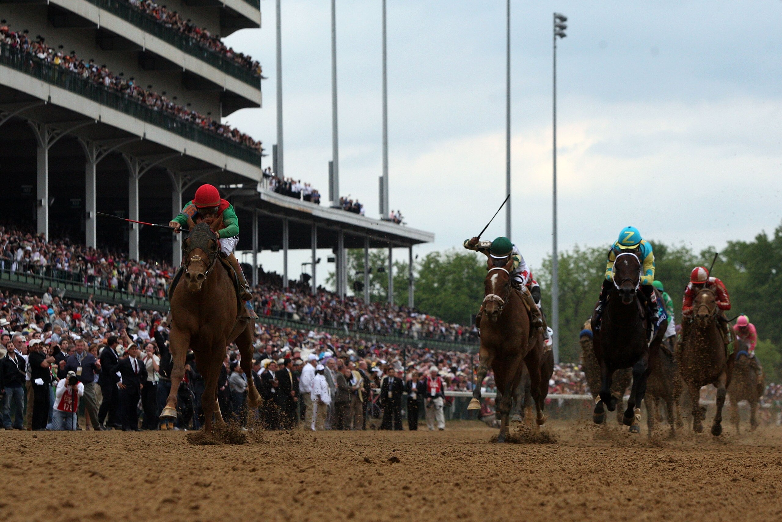 LOUISVILLE, KY - MAY 07: Jockey John Velazquez (L), riding Animal Kingdom #16 crosses the finish line ahead of Jockeys Rajiv Maragh (C), riding Mucho Macho Man #13 and Corey Nakatani, riding Nehro #19, on way to Animal Kingdom winning the 137th Kentucky LOUISVILLE, KY - MAY 07: Jockey John Velazquez (L), riding Animal Kingdom #16 crosses the finish line ahead of Jockeys Rajiv Maragh (C), riding Mucho Macho Man #13 and Corey Nakatani, riding Nehro #19, on way to Animal Kingdom winning the 137th Kentucky