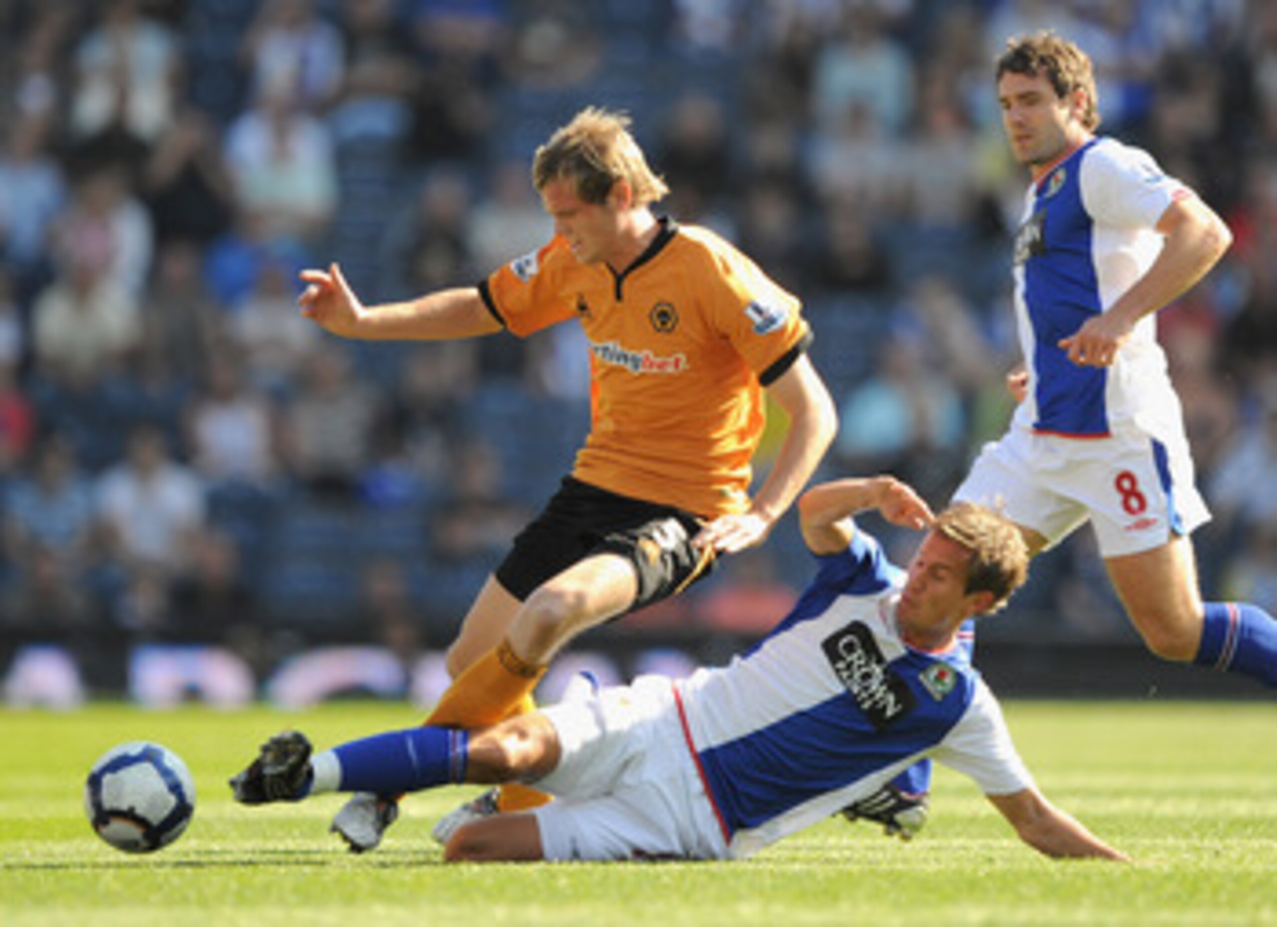 BLACKBURN, ENGLAND - SEPTEMBER 12: Richard Stearman of Wolves battles with Morten Gamst Pedersen of Blackburn Rovers during the Barclays Premier League match between Blackburn Rovers and Wolverhampton Wanderers at Ewood Park on September 12, 2009 in Black