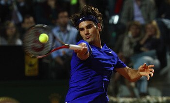 ROME, ITALY - MAY 11:  Roger Federer of Switzerland plays a forehand during his second round match against Jo-Wilfried Tsonga of France during day four of the Internazoinali BNL D'Italia at the Foro Italico Tennis Centre on May 11, 2011 in Rome, Italy.  (