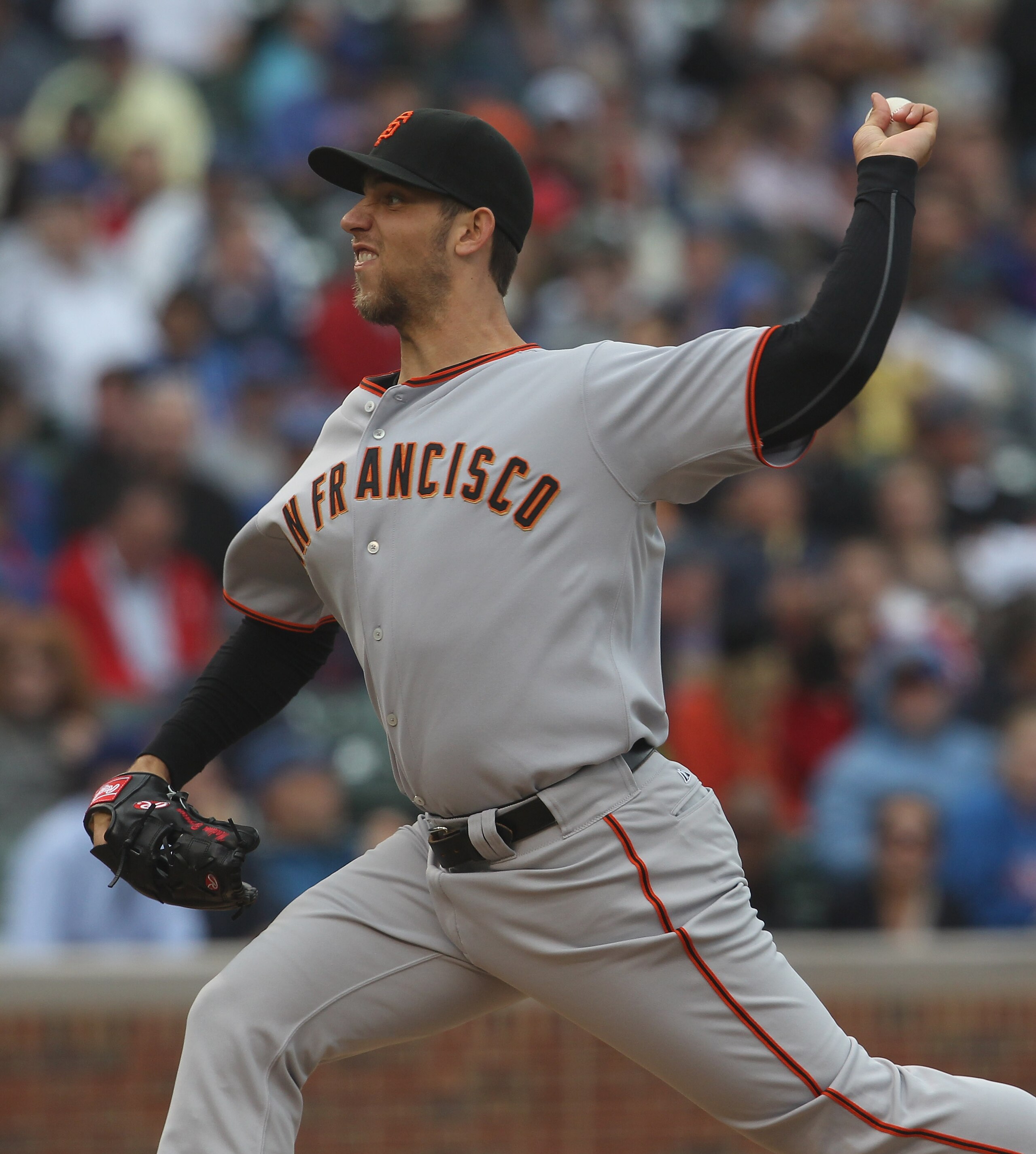 CHICAGO, IL - MAY 13: Starting pitcher Madison Bumgarner #40 of the San Francisco Giants delivers the ball against the Chicago Cubs at Wrigley Field on May 13, 2011 in Chicago, Illinois. (Photo by Jonathan Daniel/Getty Images)