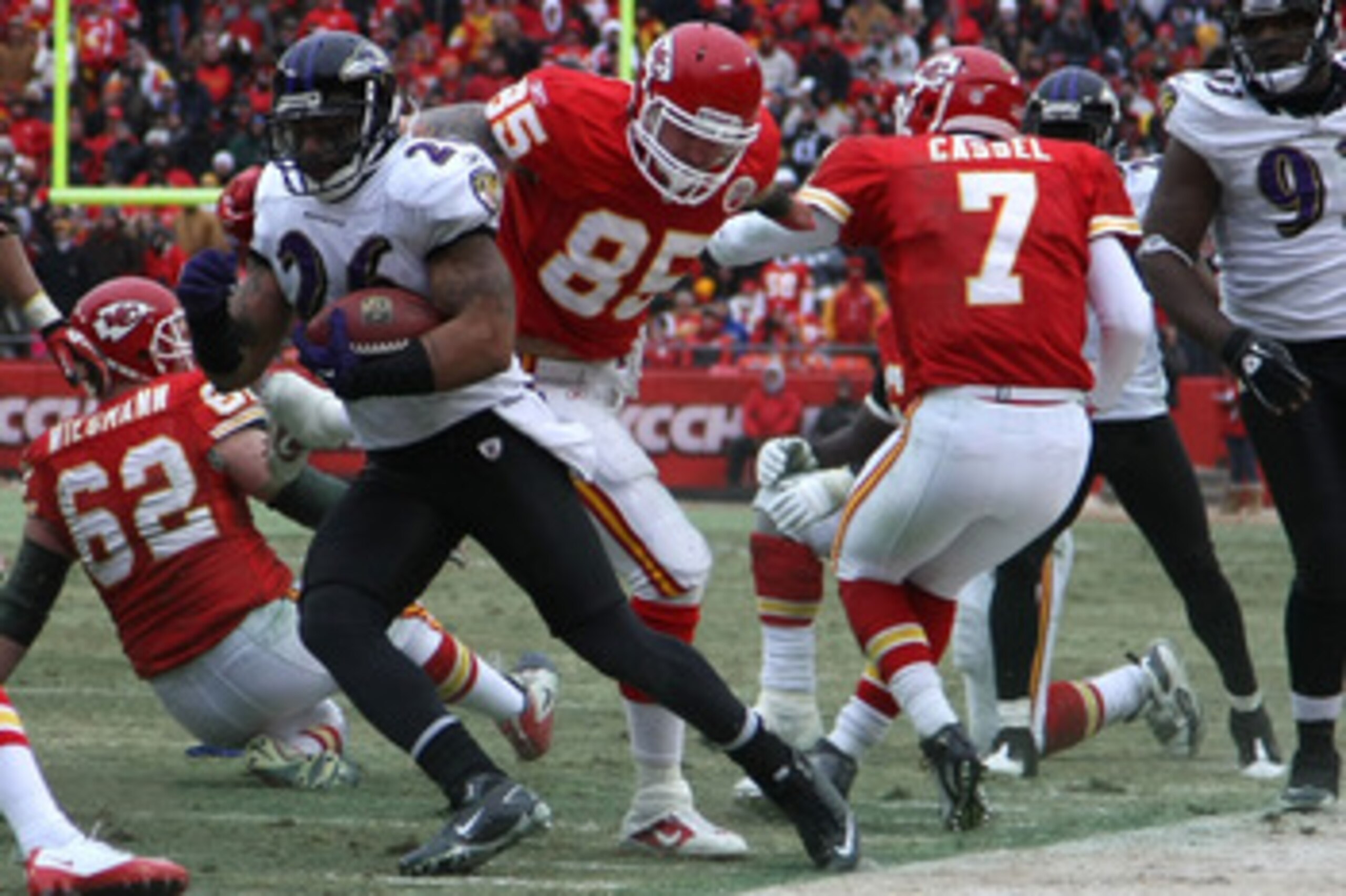 KANSAS CITY, MO - JANUARY 09:  Safety Dawan Landry #26 of the Baltimore Ravens runs back an interception of quarterback Matt Cassel #7 of the Kansas City Chiefs in the third quarter of their 2011 AFC wild card playoff game at Arrowhead Stadium on January 