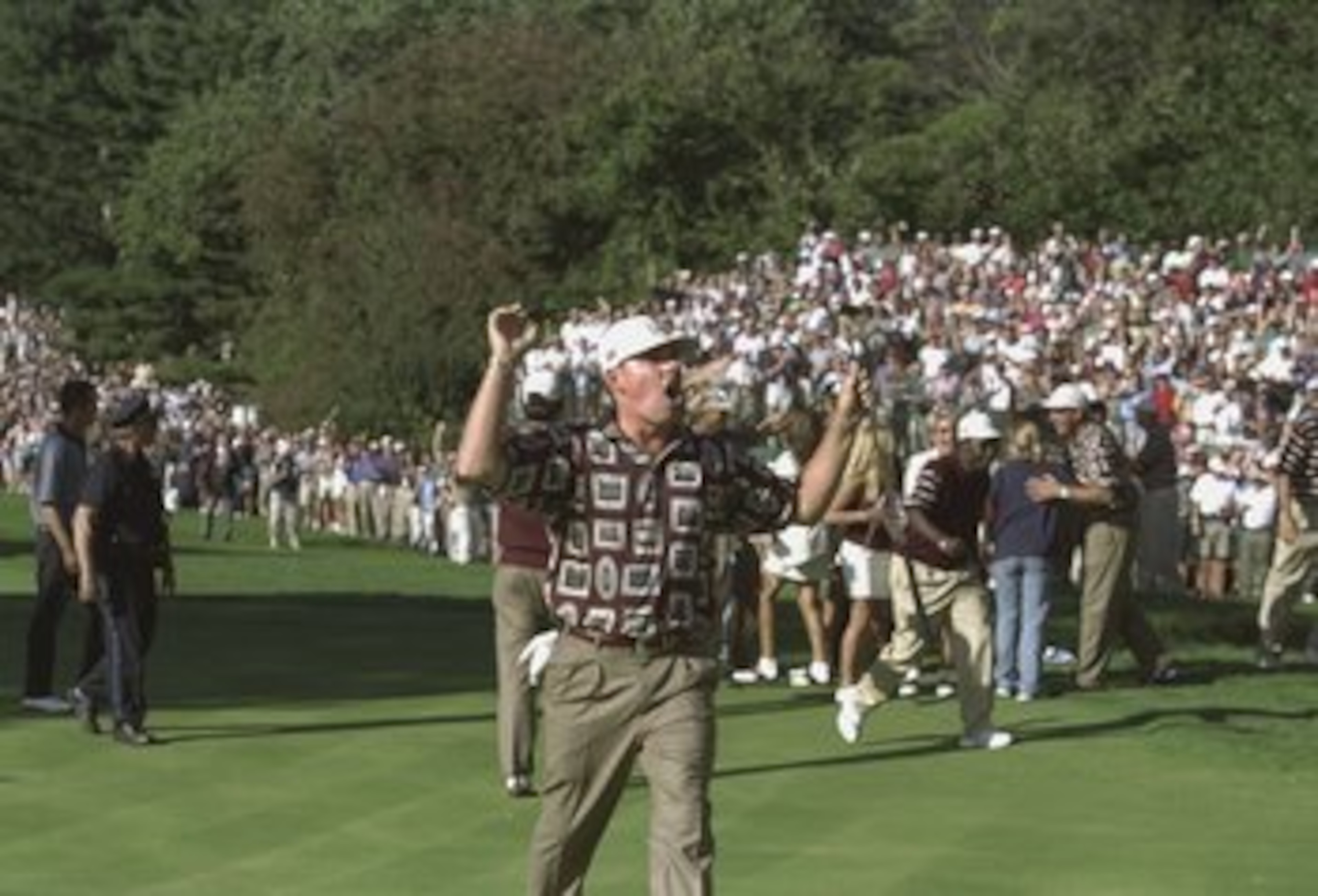 26 Sep 1999:  Justin Leonard of the USA asks the USA team to leave the 17th green during the 33rd Ryder Cup match played at the Brookline CC in Boston, Massachusetts, USA. \ Mandatory Credit: Andrew Redington /Allsport
