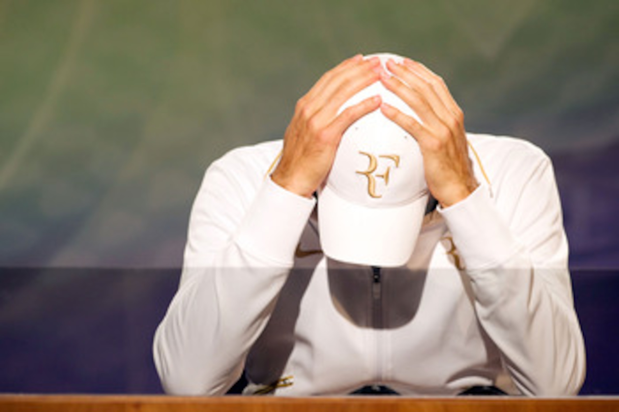 LONDON, ENGLAND - JUNE 30:  Roger Federer of Switzerland speaks during a press conference on Day Nine of the Wimbledon Lawn Tennis Championships at the All England Lawn Tennis and Croquet Club on June 30, 2010 in London, England. (Photo by Tom Lovelock-Po