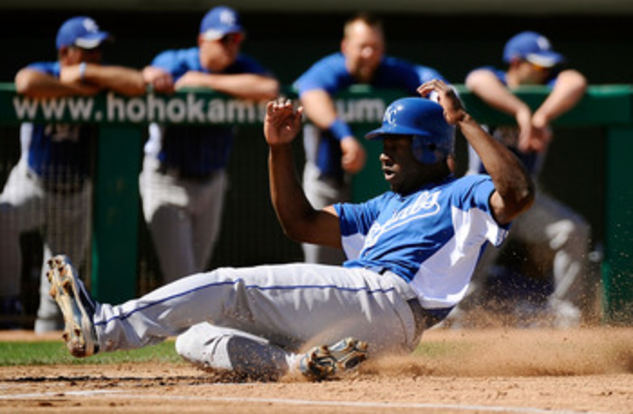 MESA, AZ - MARCH 09:  Lorenzo Cain #6 of the Kansas City Royals slides into home plate to score against the Chicago Cubs during the spring training baseball game at HoHoKam Stadium on March 9, 2011 in Mesa, Arizona.  (Photo by Kevork Djansezian/Getty Imag