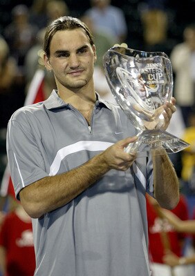 HOUSTON - NOVEMBER 16:  Roger Federer of Switzerland poses for photographers after his victory over Andre Agassi during the finals of the Tennis Masters Cup November 16, 2003 at the Westside Tennis Club in Houston, Texas. (Photo by Clive Brunskill/Getty I