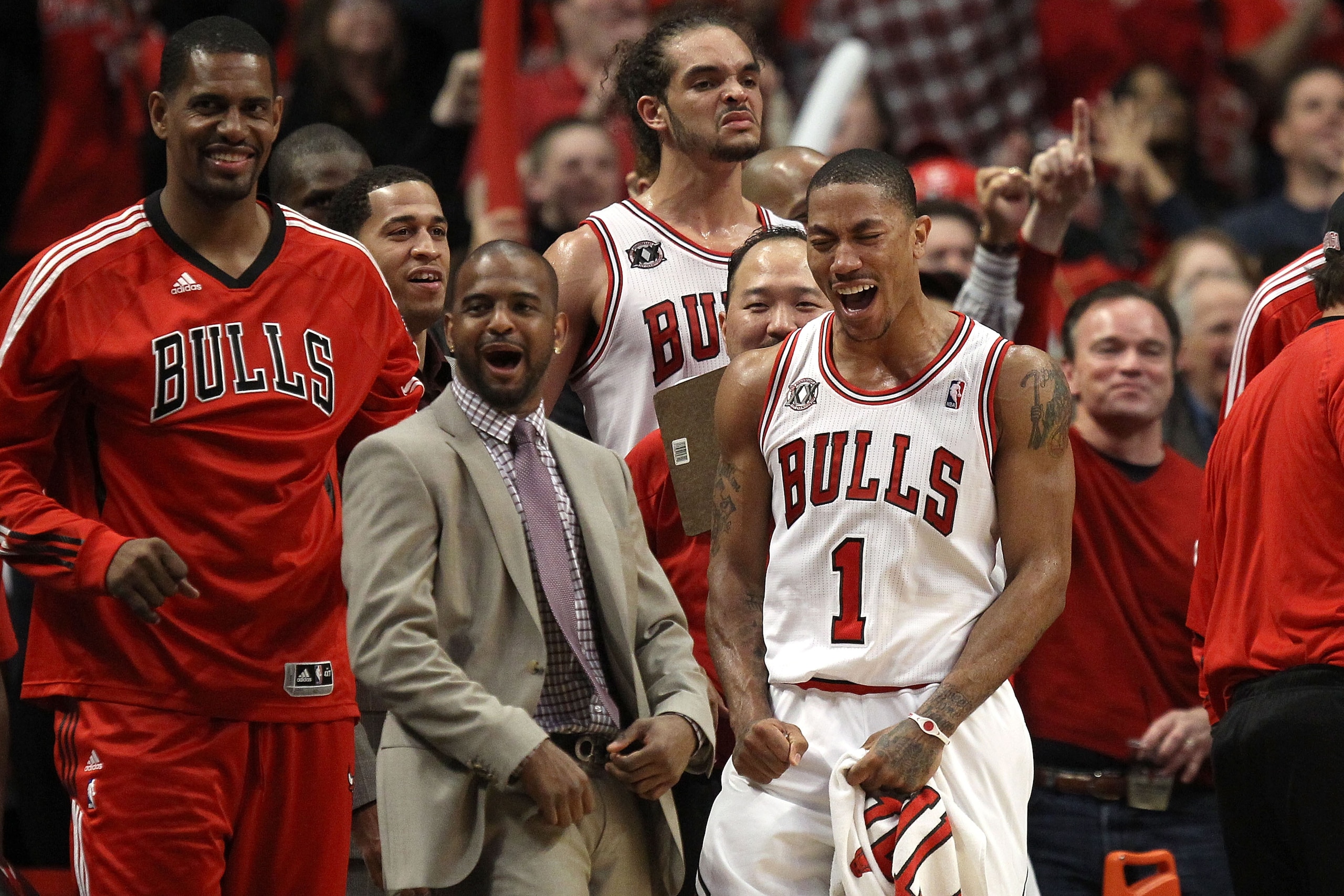 CHICAGO, IL - MAY 15:  (L-R) Kurt Thomas #40, John Lucas III, Joakim Noah #13 and Derrick Rose #1 of the Chicago Bulls celebrate late in the fourth quarter against the Miami Heat in Game One of the Eastern Conference Finals during the 2011 NBA Playoffs on