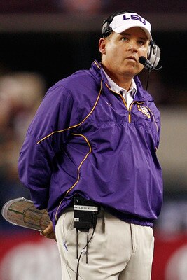 ARLINGTON, TX - JANUARY 07: Head coach Les Miles of the Louisiana State University Tigers watches the score board during a timeout against the Texas A&M Aggies during the AT&T Cotton Bowl at Cowboys Stadium on January 7, 2011 in Arlington, Texas. (Photo ARLINGTON, TX - JANUARY 07: Head coach Les Miles of the Louisiana State University Tigers watches the score board during a timeout against the Texas A&M Aggies during the AT&T Cotton Bowl at Cowboys Stadium on January 7, 2011 in Arlington, Texas. (Photo