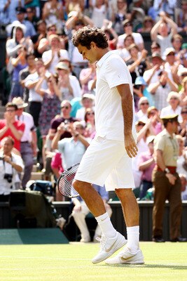 LONDON, ENGLAND - JUNE 30:  Roger Federer of Switzerland waves as he exits after losing his Quarter Final match against Tomas Berdych of Czech Republic on Day Nine of the Wimbledon Lawn Tennis Championships at the All England Lawn Tennis and Croquet Club