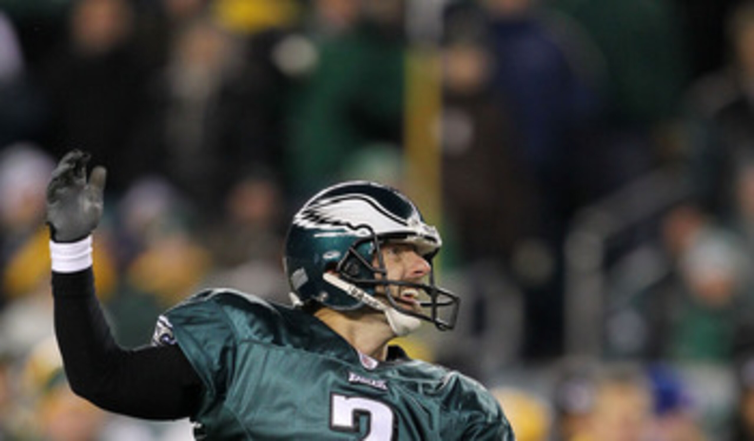 PHILADELPHIA, PA - JANUARY 09:  David Akers #2 kicks as Sav Rocca #6 of the Philadelphia Eagles holds against the Green Bay Packers during the 2011 NFC wild card playoff game at Lincoln Financial Field on January 9, 2011 in Philadelphia, Pennsylvania.  (P