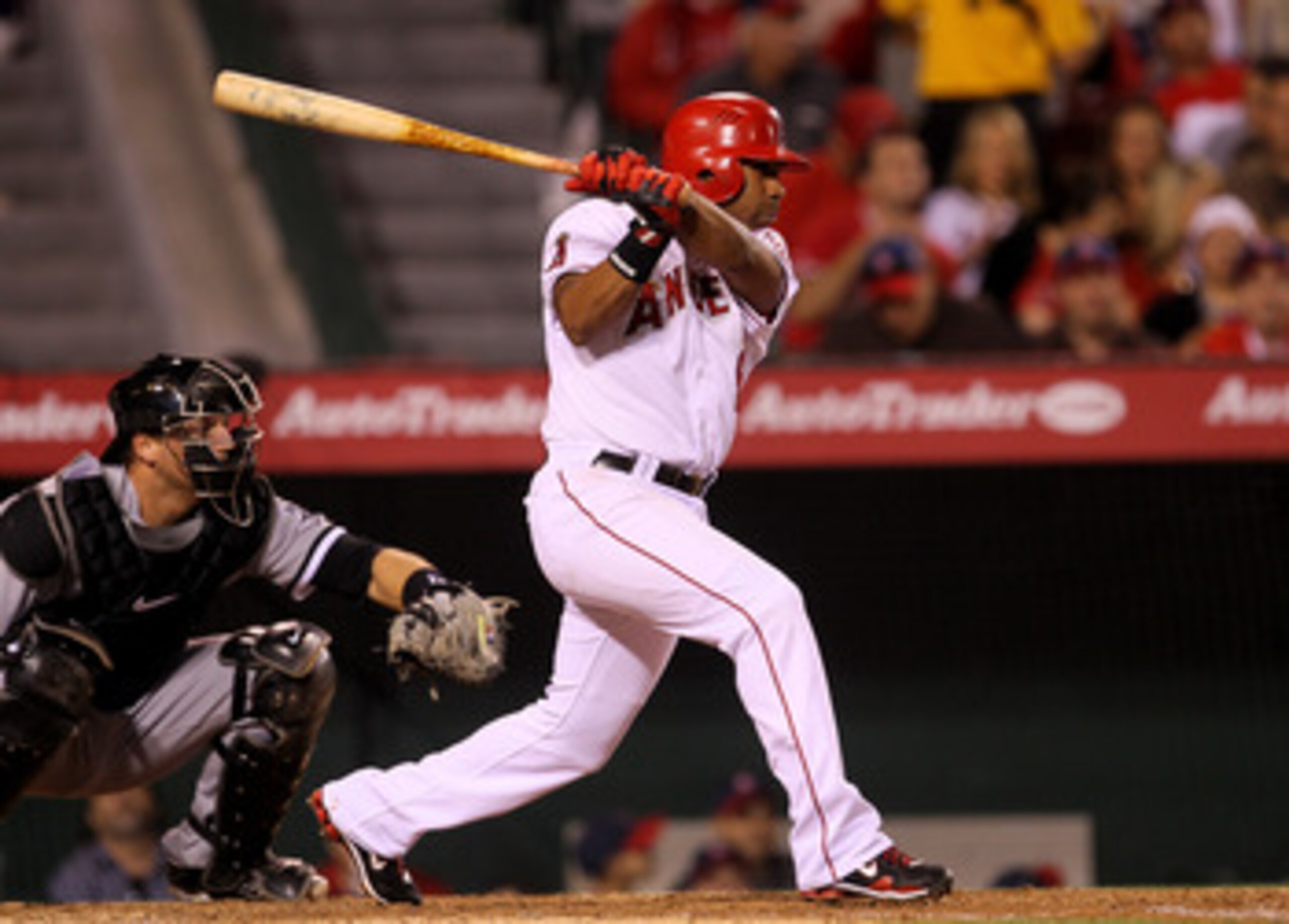 ANAHEIM, CA - MAY 11:  Alberto Callaspo #6 of the Los Angeles Angels of Anaheim hits an RBI single in the sixth inning against the Chicago White Sox on May 11, 2011 at Angel Stadium in Anaheim, California.  (Photo by Stephen Dunn/Getty Images)