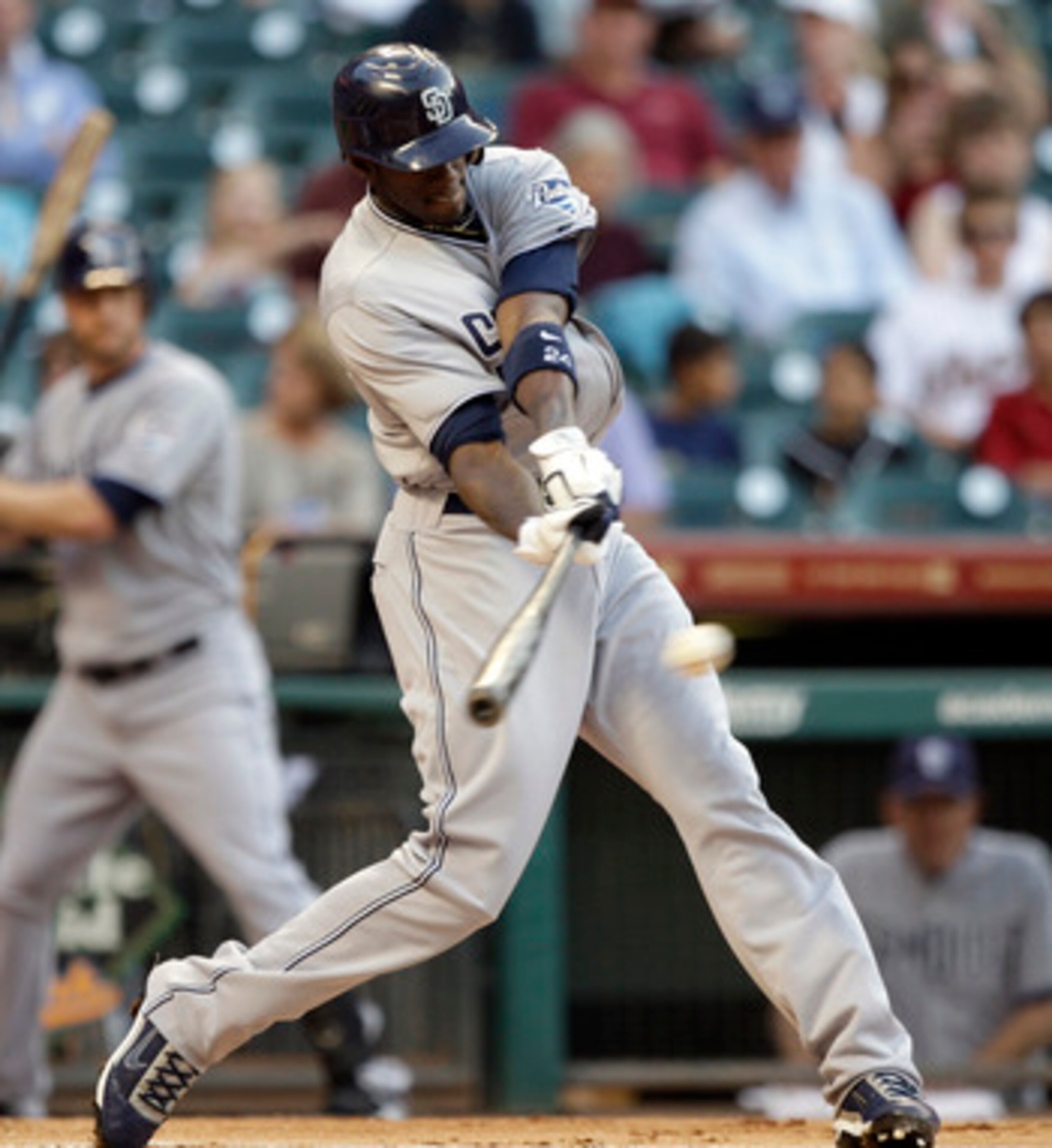 HOUSTON - APRIL 15:  Cameron Maybin #24 of the San Diego Padres singles in the first inning against the Houston Astros in the first inning at Minute Maid Park on April 15, 2011 in Houston, Texas.  (Photo by Bob Levey/Getty Images)