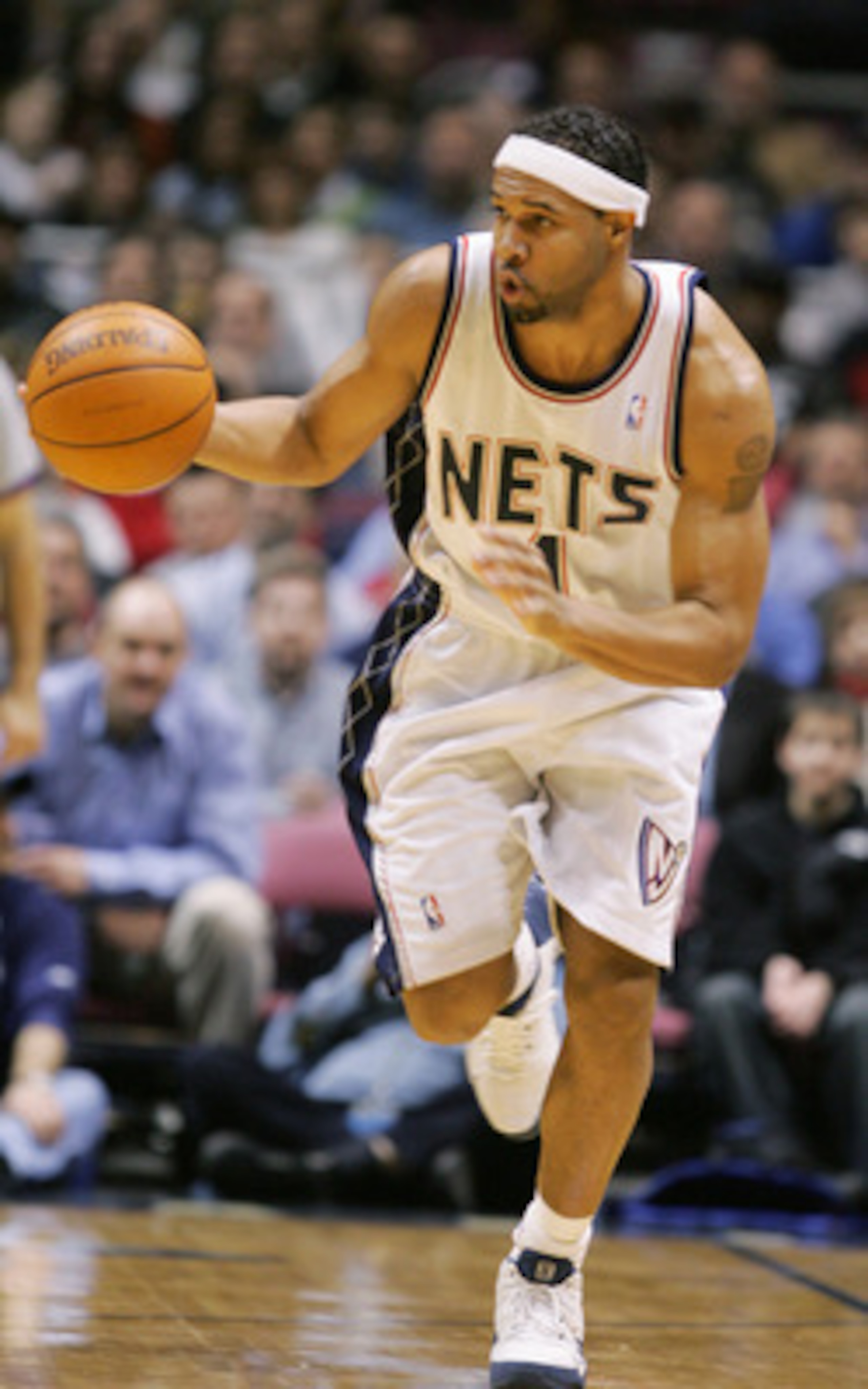 EAST RUTHERFORD, NJ - FEBRUARY 5:  Ron Mercer #1 of the New Jersey Nets advances the ball upcourt during the game against the Philadelphia Sixers on February 7, 2005 at Continental Airlines Arena in East Rutherford, New Jersey.  NOTE TO USER:  User expres