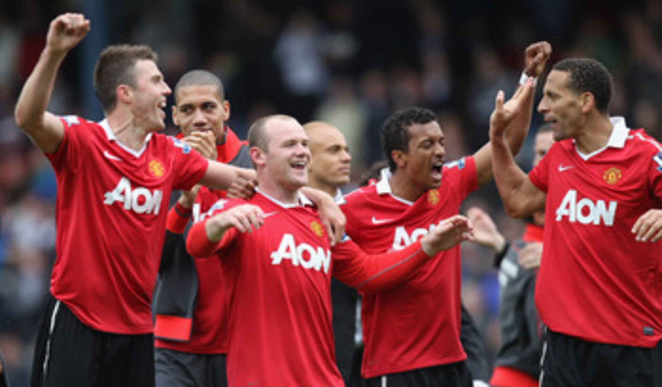 BLACKBURN, ENGLAND - MAY 14:  Michael Carrick (L),Chris Smalling (2L),Wayne Rooney (3L), Nani (2R) and Rio Ferdinand of Manchester United celebrate clinching the title during the Barclays Premier League match between Blackburn Rovers and Manchester United