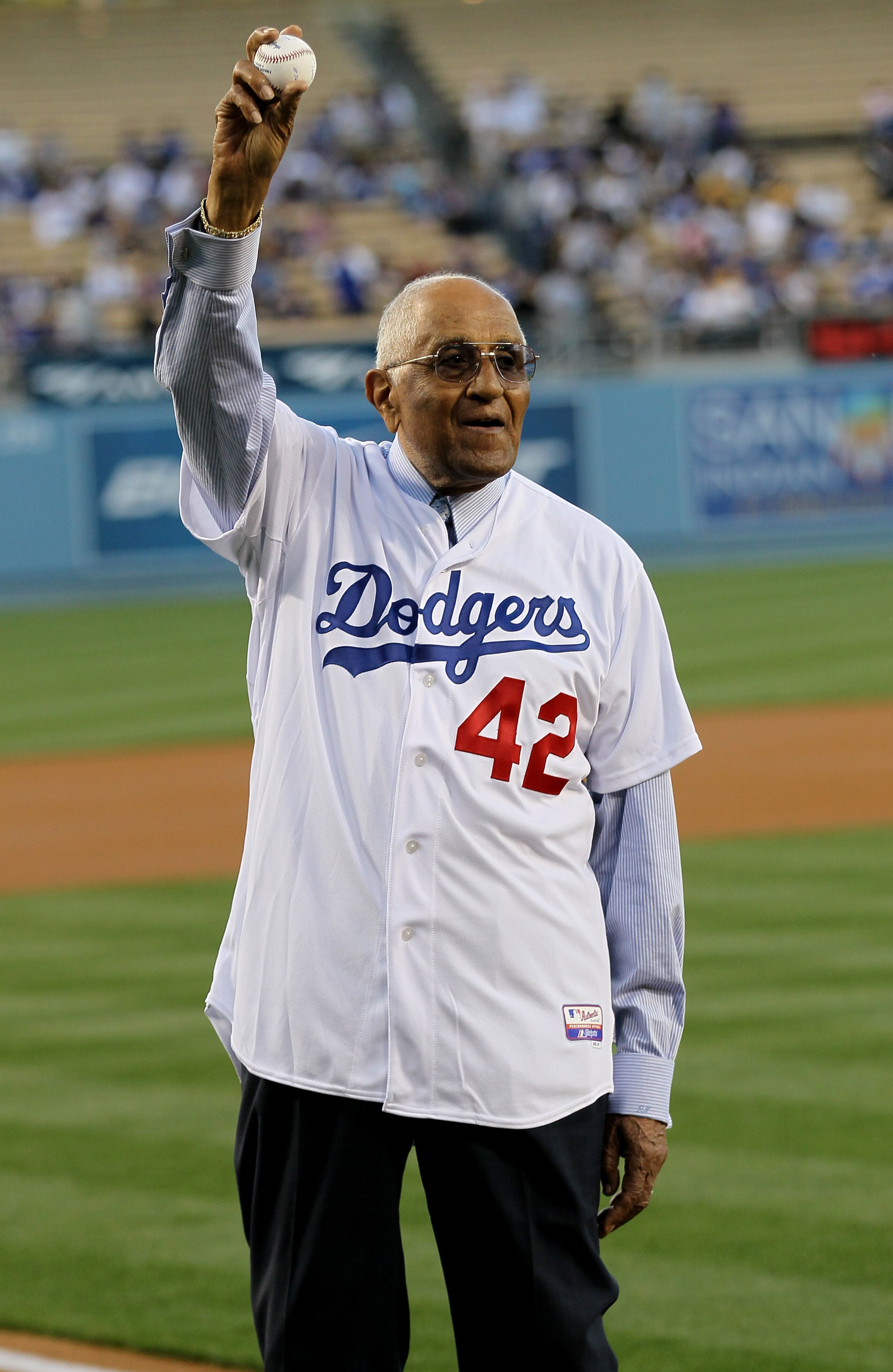 LOS ANGELES, CA - APRIL 15: Don Newcombe, former Brooklyn Dodgers teammate of Jackie Robinson, waves before throwing out the ceremonial first pitch of the game between the Los Angeles Dodgers and the St. Louis Cardinals as Major League Baseball celebrat LOS ANGELES, CA - APRIL 15: Don Newcombe, former Brooklyn Dodgers teammate of Jackie Robinson, waves before throwing out the ceremonial first pitch of the game between the Los Angeles Dodgers and the St. Louis Cardinals as Major League Baseball celebrat