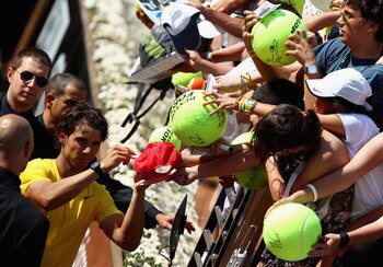 ROME, ITALY - MAY 11:  Rafael Nadal of Spain signs autographs after his second round match against Paolo Lorenzi of Italy during day four of the Internazoinali BNL D'Italia at the Foro Italico Tennis Centre on May 11, 2011 in Rome, Italy.  (Photo by Clive