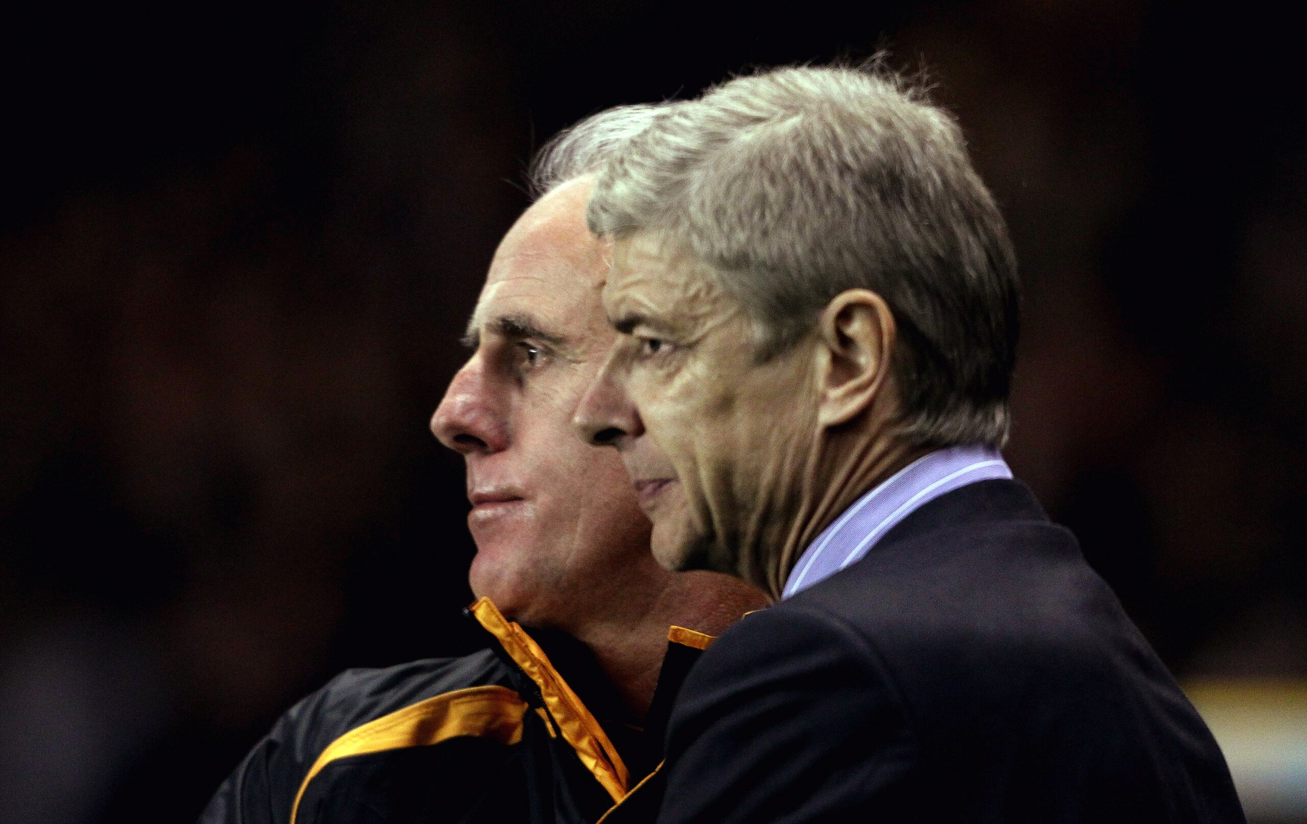 WOLVERHAMPTON, ENGLAND - NOVEMBER 10: Wolves manager Mick McCarthy (L) and Arsenal manager Arsene Wenger look on during the Barclays Premier League match between Wolverhampton Wanderers and Arsenal, at Molineux  on November 10, 2010 in Wolverhampton, Engl
