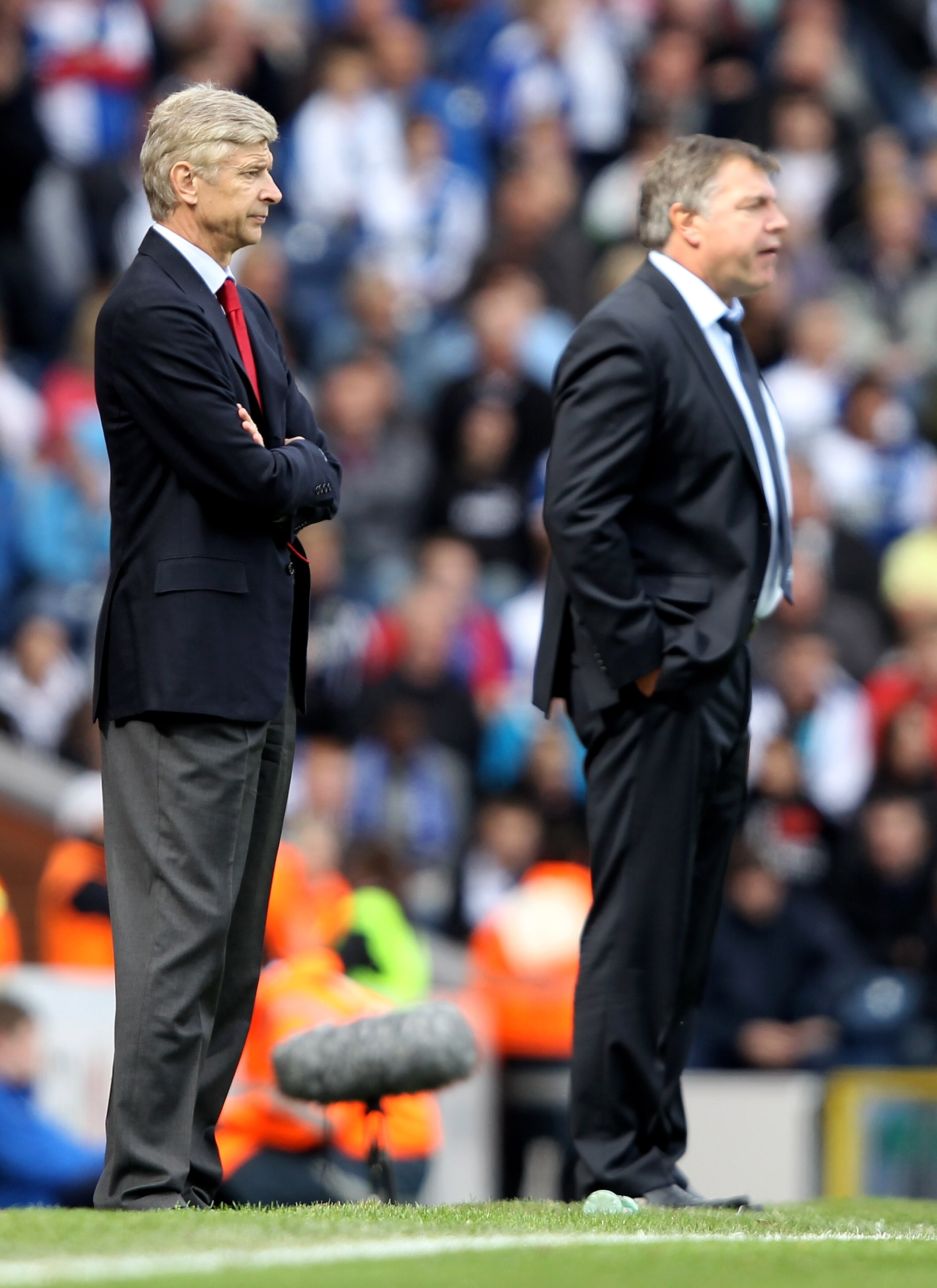 BLACKBURN, ENGLAND - AUGUST 28: Arsenal manager Arsene Wenger watches along side Blackburn Rovers manager Sam Allardyce during the Barclays Premier League match between Blackburn Rovers and Arsenal at Ewood Park on August 28, 2010 in Blackburn, England. (