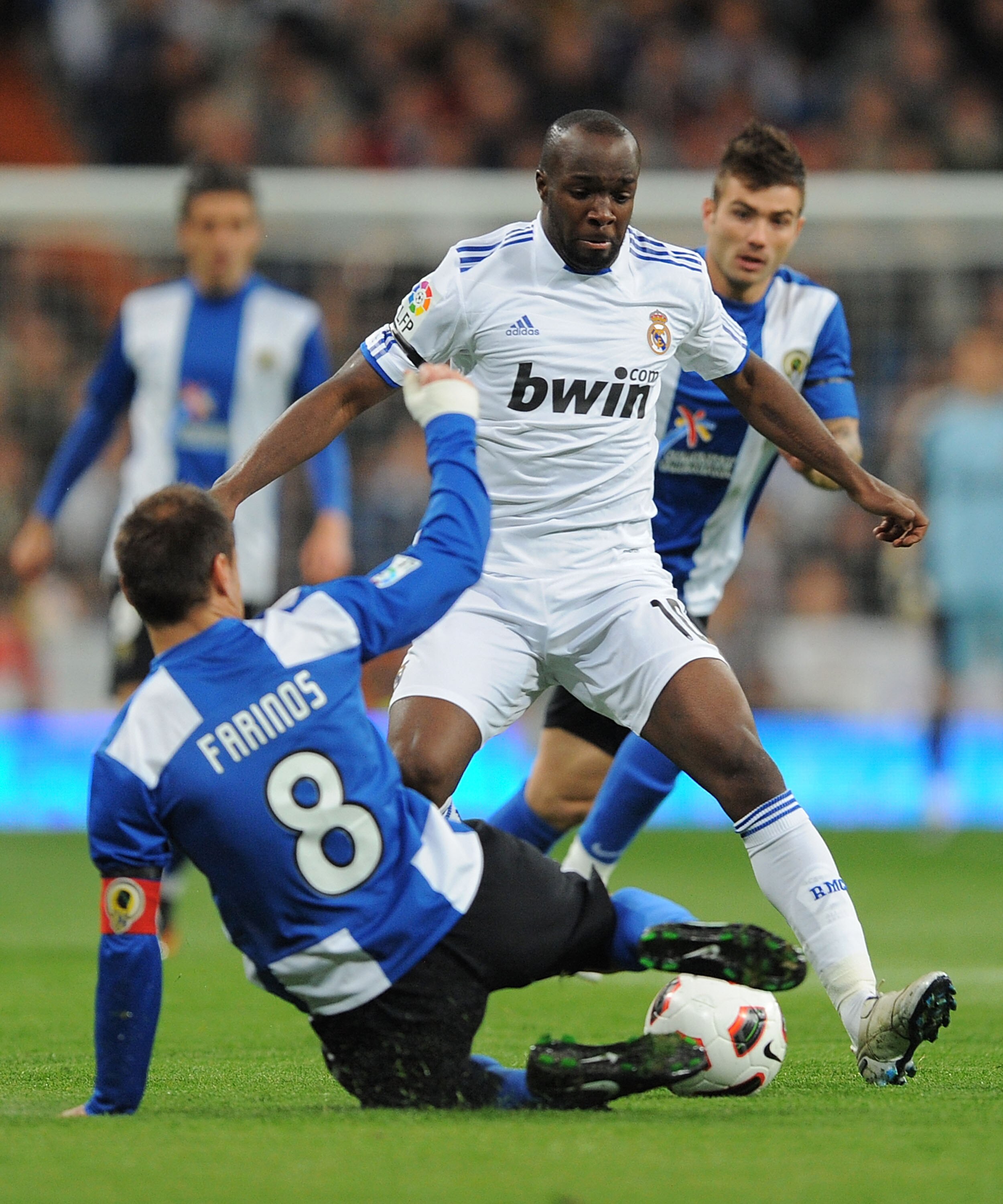 MADRID, SPAIN - MARCH 12: Lass Diarra of Real Madrid takes on ;Francisco Farinos of Hercules CF   during the La Liga match between Real Madrid and Hercules CF at Estadio Santiago Bernabeu on March 12, 2011 in Madrid, Spain.  (Photo by Denis Doyle/Getty Im