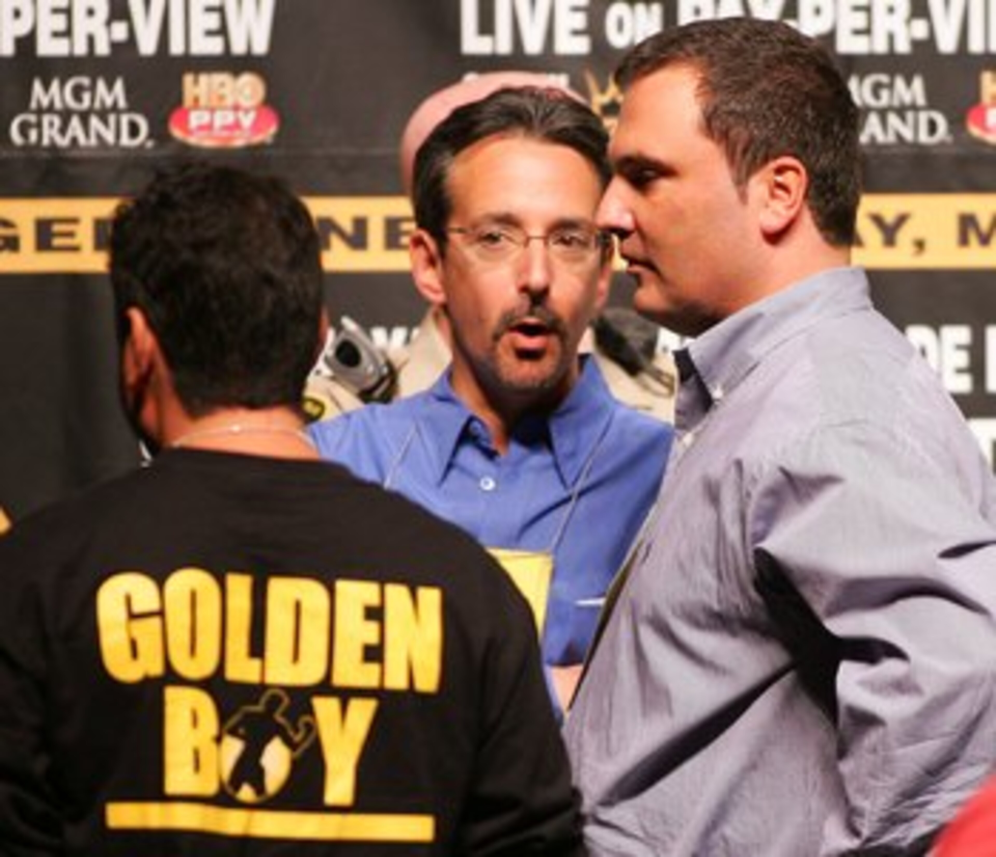 LAS VEGAS - MAY 05:  Richard Shaefer, business partner of boxer Oscar De La Hoya, talks with Mark Taffet (C), a senior vice president with HBO, at the weigh-in for De La Hoya and Ricardo Mayorga at the MGM Grand Garden Arena May 5, 2006 in Las Vegas, Neva