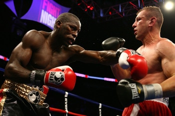 NEWARK, NJ - DECEMBER 11:  Steve Cunningham punches Tomasz Adamek during their IBF Cruiserweight Championship fight on December 11, 2008 at The Prudential Center in Newark, New Jersey.  Tomasz won a split decision.  (Photo by Al Bello/Getty Images)