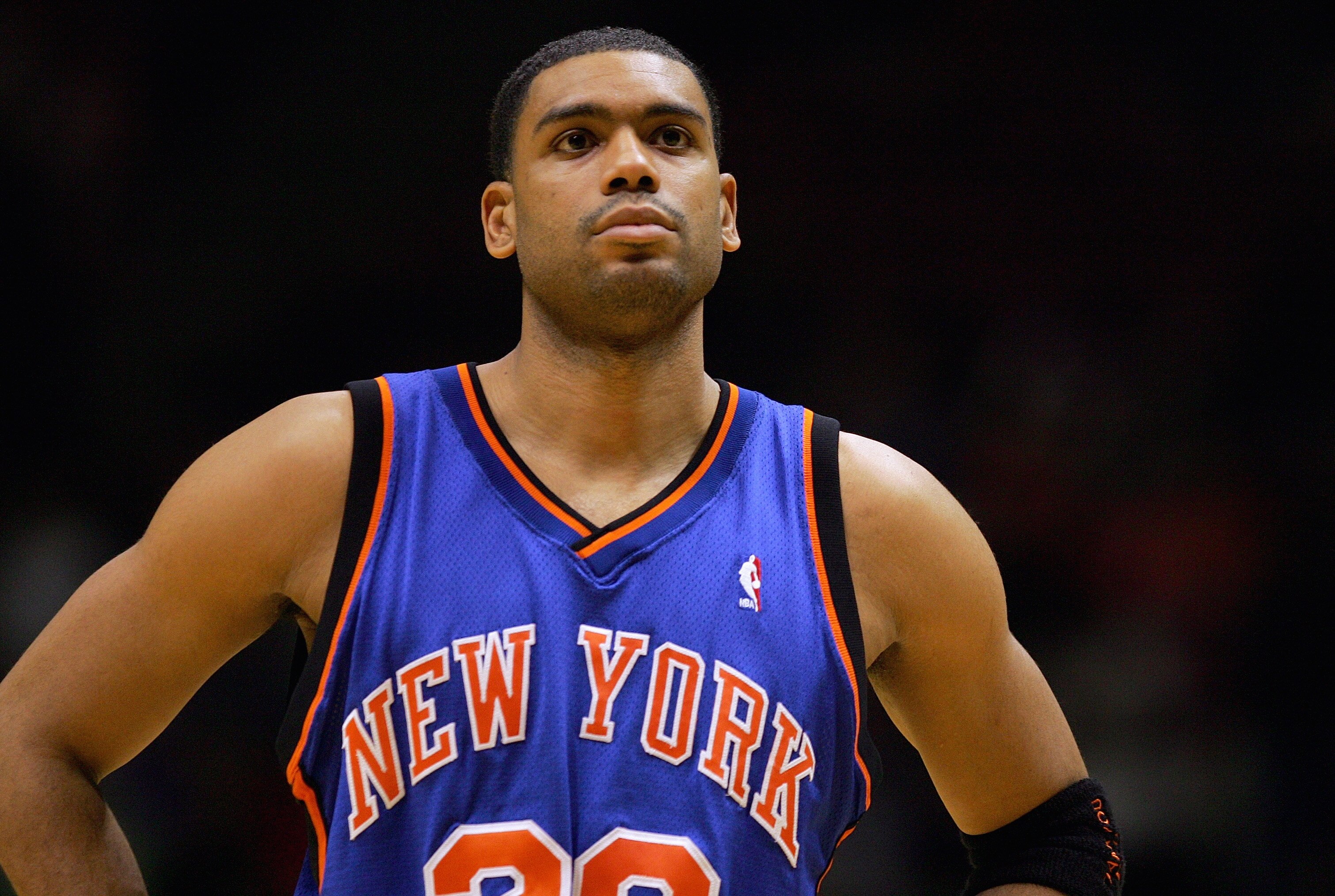 EAST RUTHERFORD, NJ - DECEMBER 14:  Allan Houston #20 of the New York Knicks looks on during a game against the New Jersey Nets on December 14, 2004 at Continental Airlines Arena in East Rutherford, New Jersey. The Knicks won 87-79. NOTE TO USER: User exp
