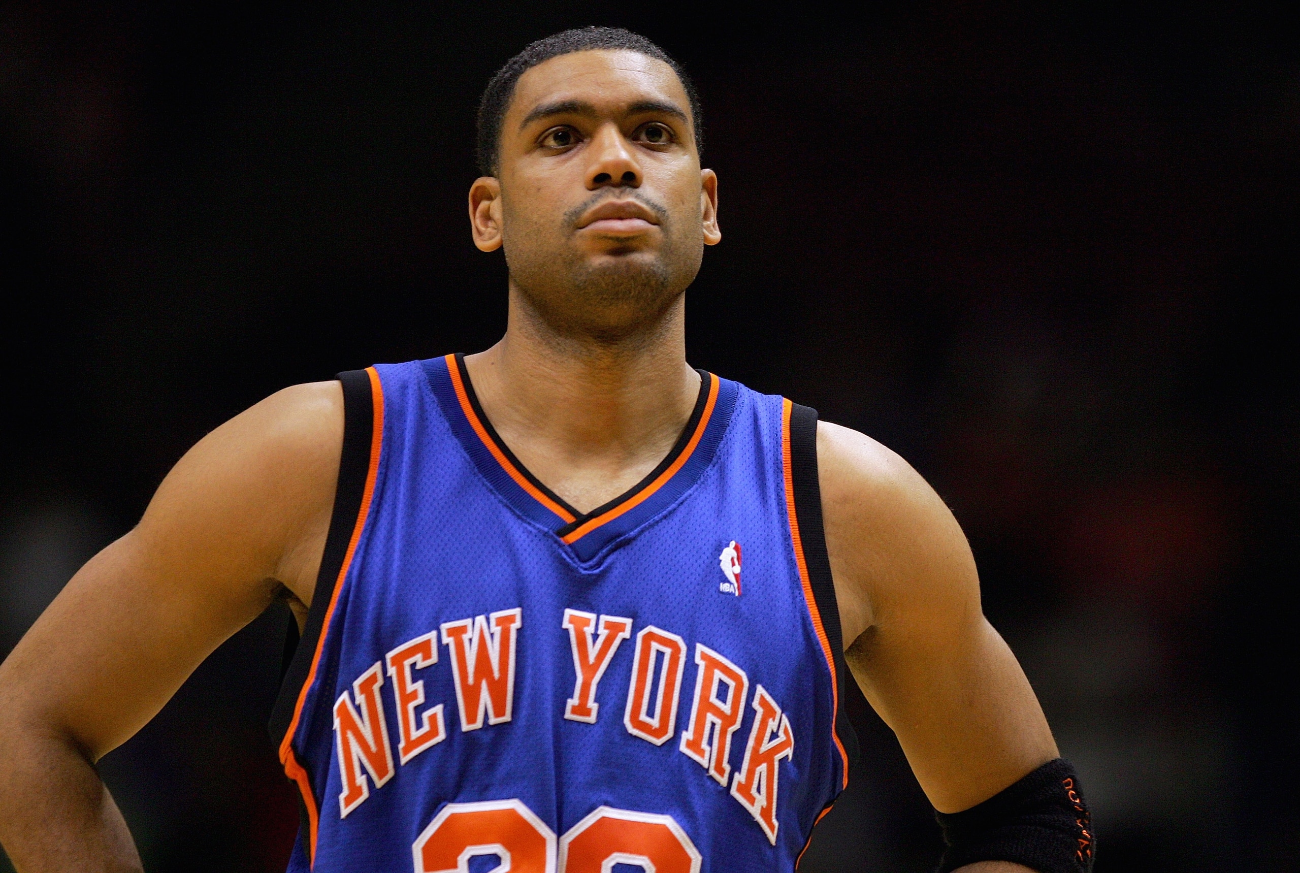 EAST RUTHERFORD, NJ - DECEMBER 14:  Allan Houston #20 of the New York Knicks looks on during a game against the New Jersey Nets on December 14, 2004 at Continental Airlines Arena in East Rutherford, New Jersey. The Knicks won 87-79. NOTE TO USER: User exp