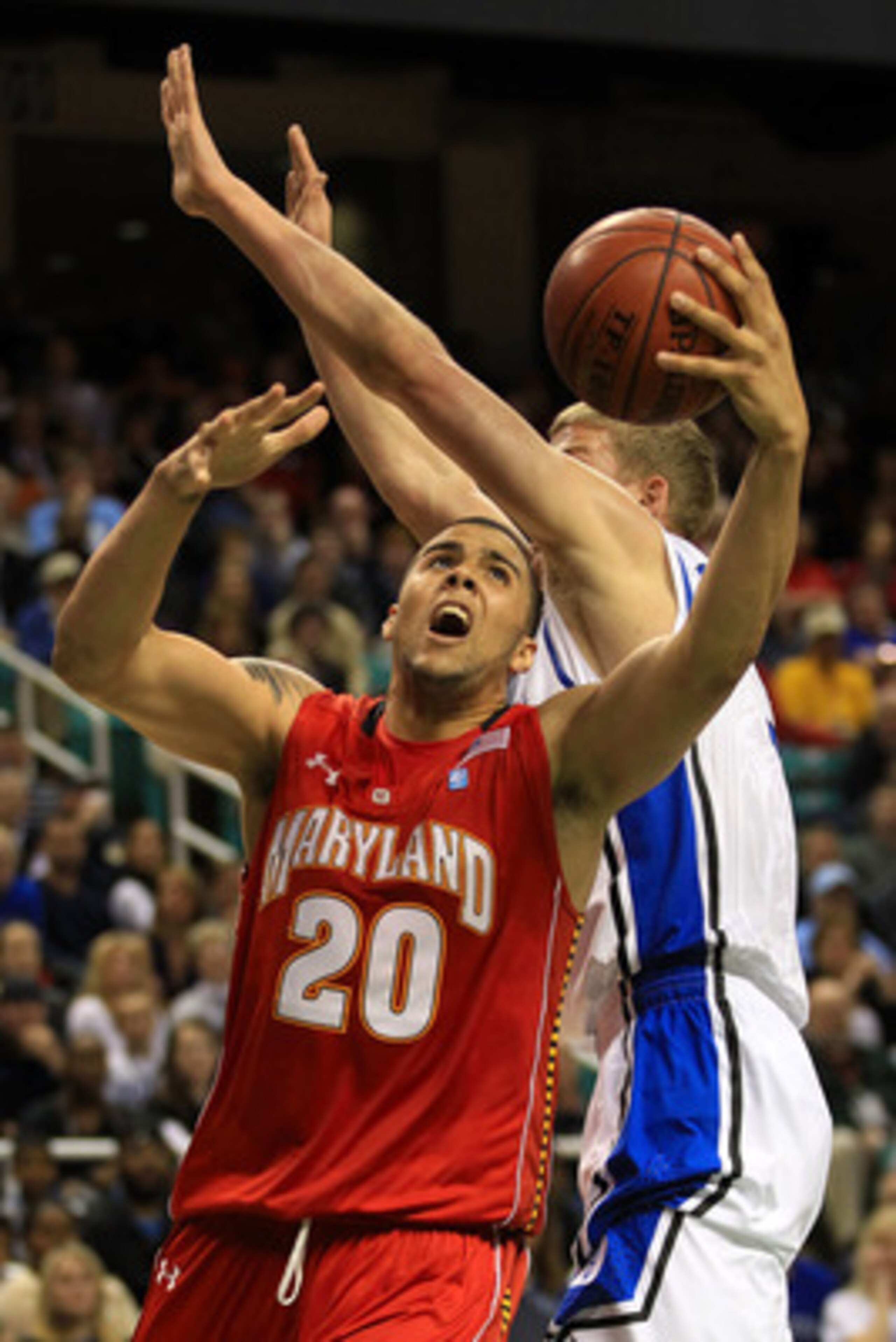 GREENSBORO, NC - MARCH 11:  Jordan Williams #20 of the Maryland Terrapins shoots against Mason Plumlee #5 of the Duke Blue Devils during the first half in the quarterfinals of the 2011 ACC men's basketball tournament at the Greensboro Coliseum on March 11
