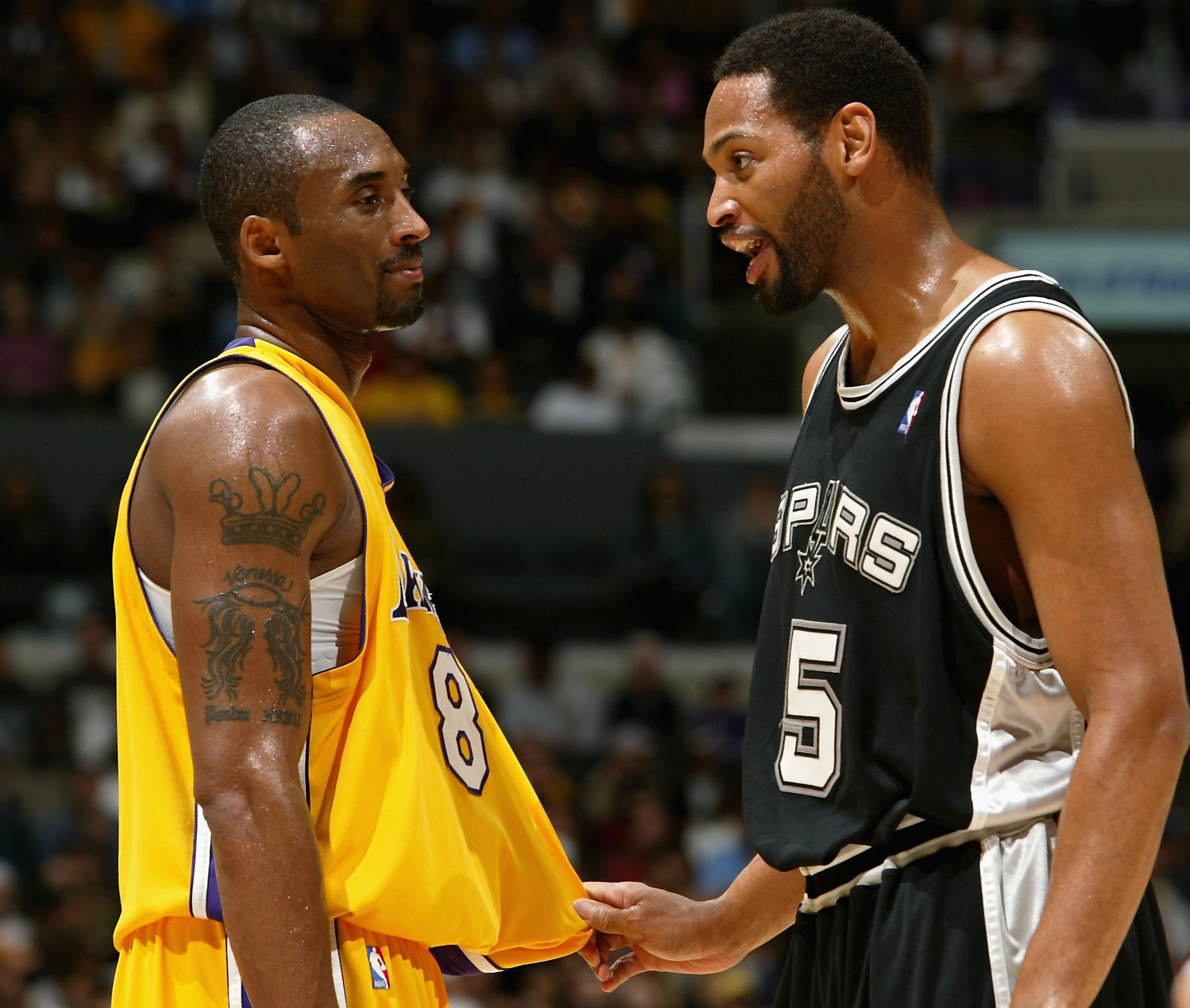 LOS ANGELES - MARCH 30:  Robert Horry #5 of the San Antonio Spurs and Kobe Bryant #8 of the Los Angeles Lakers joke during a timeout March 30, 2006 at Staples Center in Los Angeles, California. The Spurs won, 96-85. NOTE TO USER: User expressly acknowledg