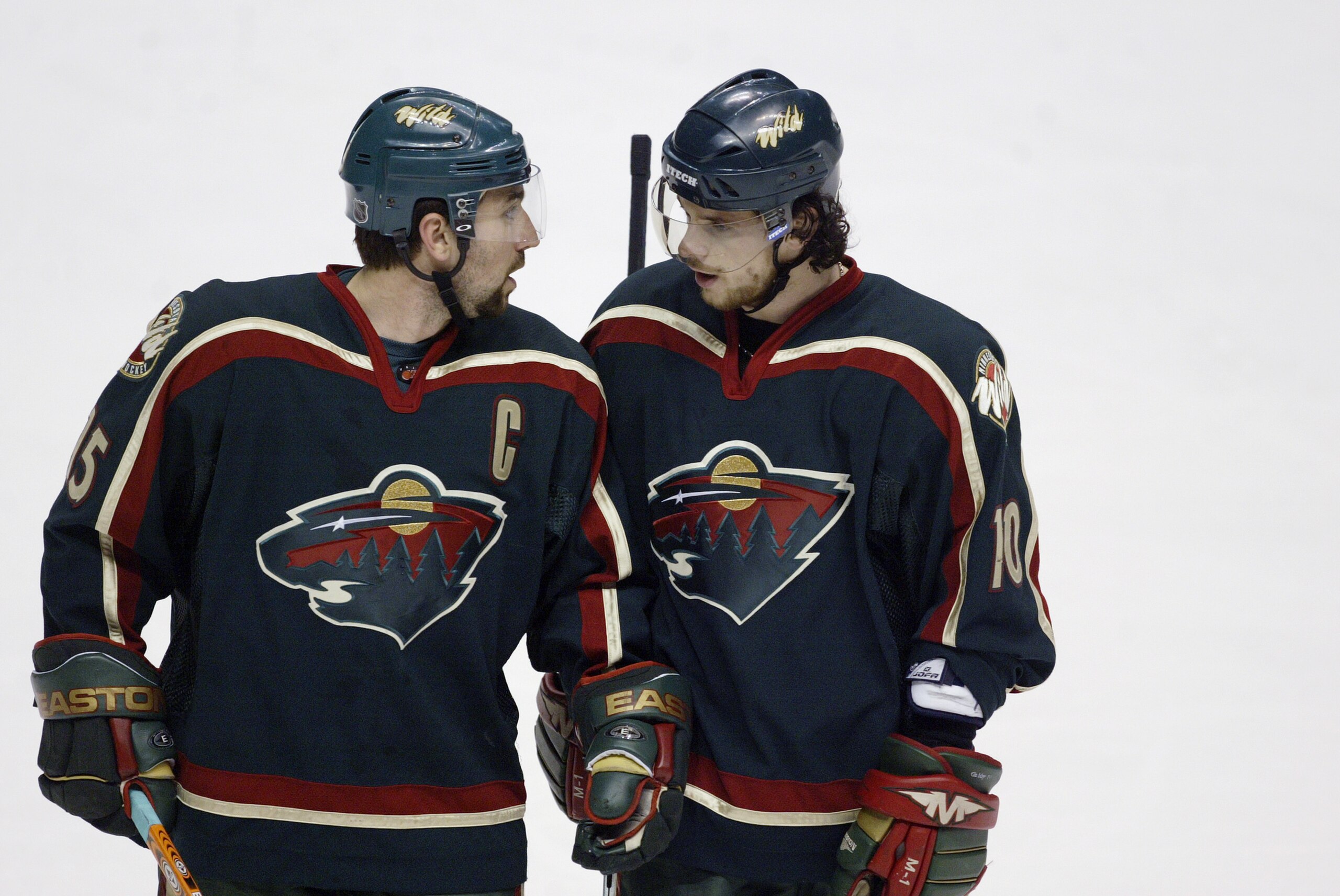ANAHEIM, CA - MAY 14:  Andrew Brunette #15 of the Minnesota Wild talks to teammate Marian Gaborik #10 against the Mighty Ducks of Anaheim in game three of the 2003 Western Conference Stanley Cup Finals at the Pond of Anaheim on May 14, 2003 in Anaheim, Ca