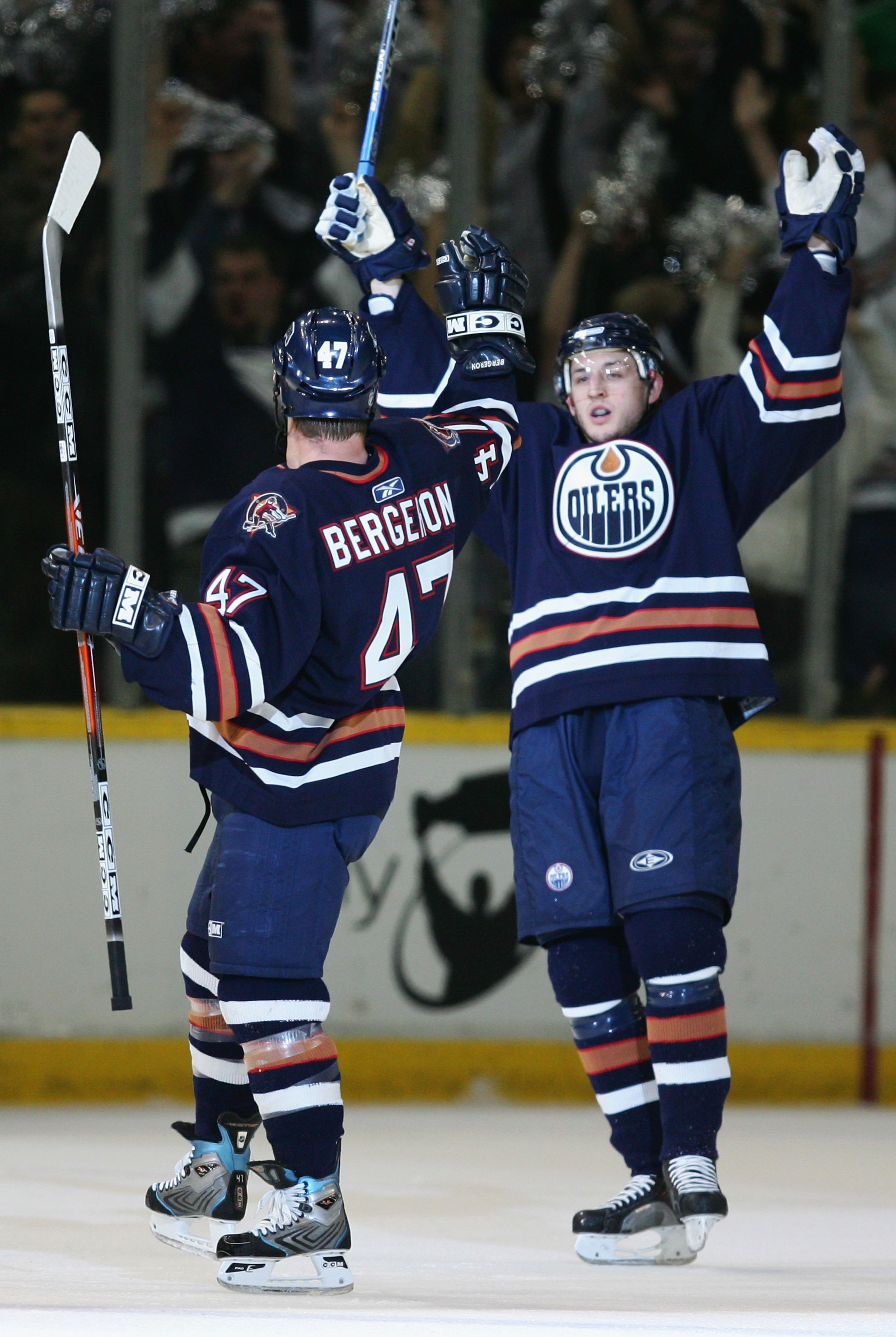 EDMONTON, AB - MAY 10:  Shawn Horcoff #10 (R) of the Edmonton Oilers celebrates after Marc-Andre Bergeron #47 (L) scored a power play goal against the San Jose Sharks in game three of the Western Conference Semifinals at Rexall Place on May 10, 2006 in Ed