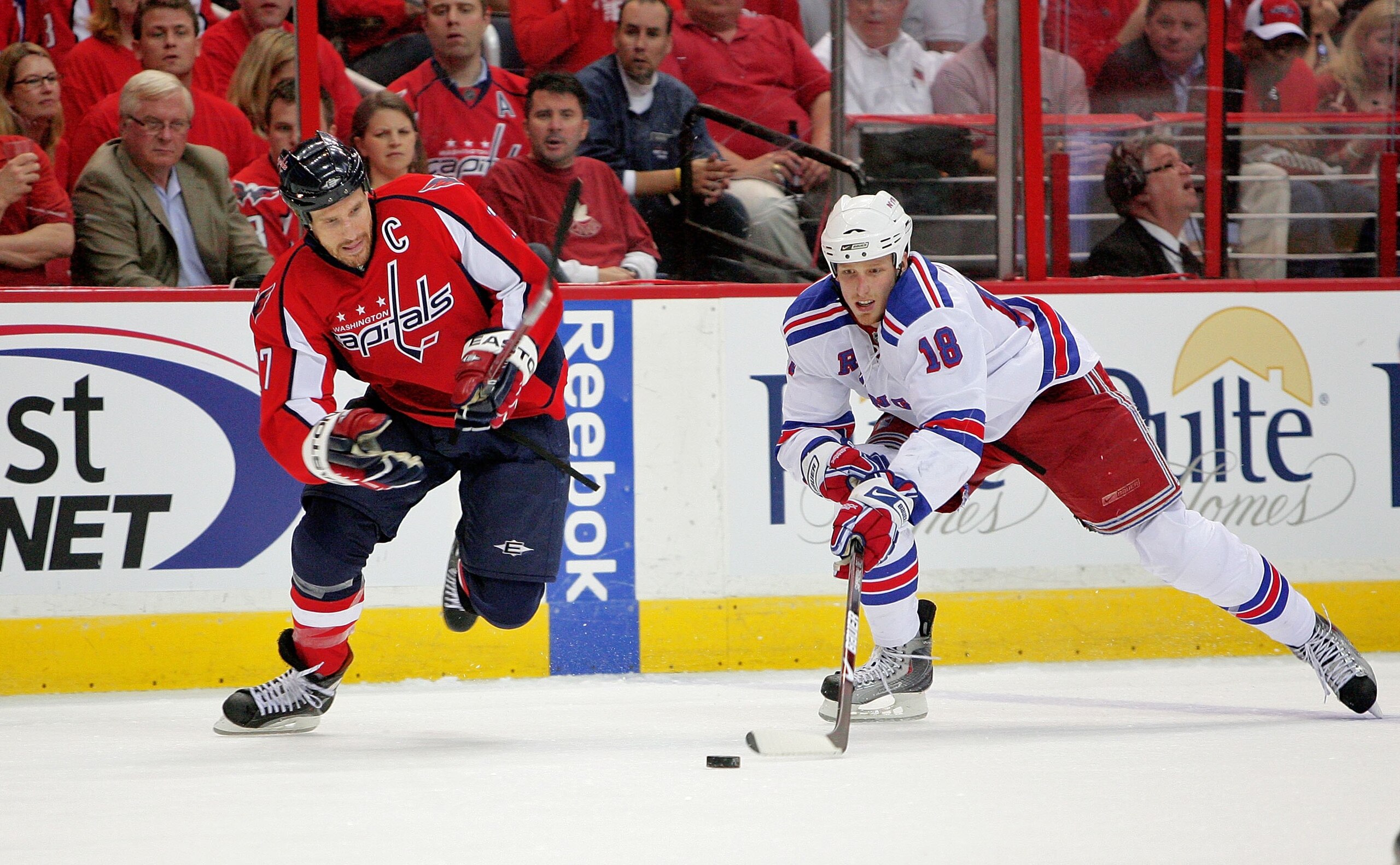 WASHINGTON - APRIL 28:  Chris Clark #17 of the Washington Capitals battles for the puck against Marc Staal #18 of the New York Rangers during Game Seven of the Eastern Conference Quarterfinal Round of the 2009 Stanley Cup Playoffs on April 28, 2009 at the