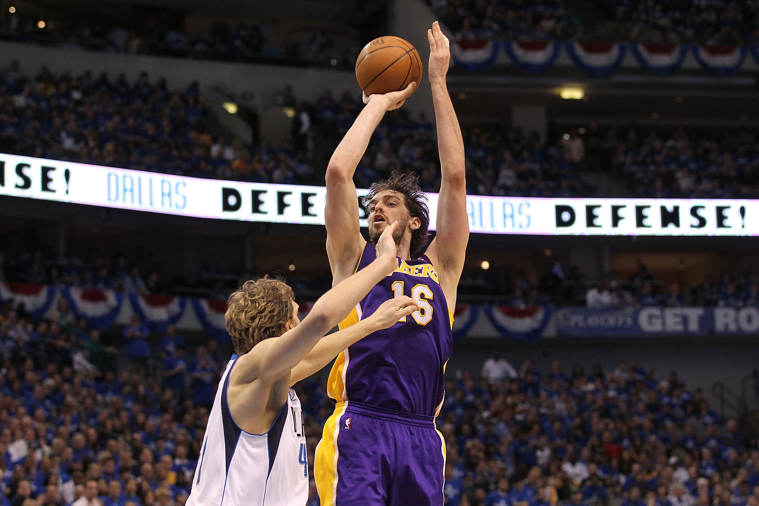 DALLAS, TX - MAY 06:  Forward Pau Gasol #16 of the Los Angeles Lakers takes a shot against Dirk Nowitzki #41 of the Dallas Mavericks in Game Three of the Western Conference Semifinals during the 2011 NBA Playoffs on May 6, 2011 at American Airlines Center