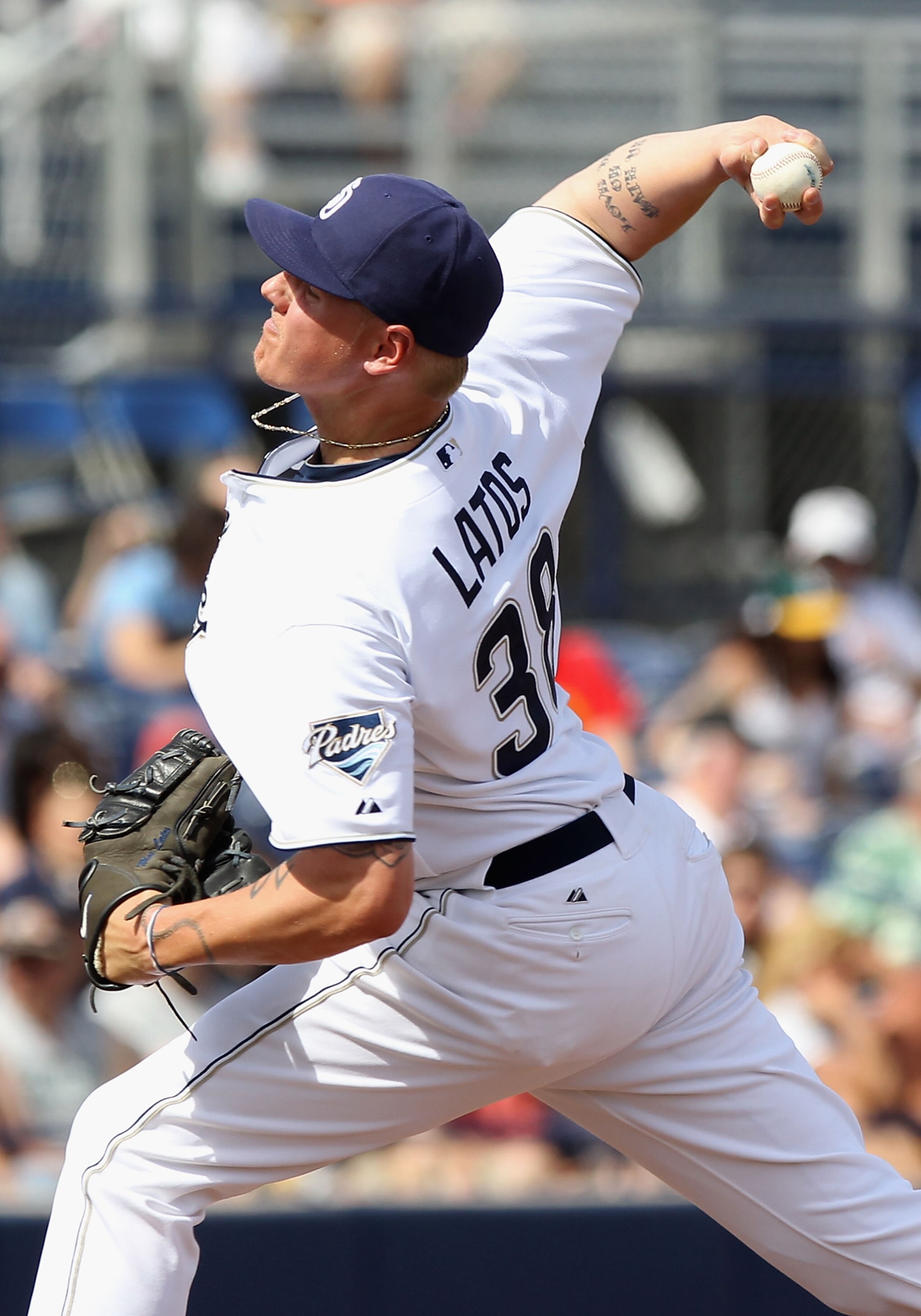 PEORIA, AZ - MARCH 06:  Starting pitcher Mat Latos #38 of the San Diego Padres pitches against the Oakland Athletics during the spring training game at Peoria Stadium on March 6, 2011 in Peoria, Arizona.  (Photo by Christian Petersen/Getty Images)