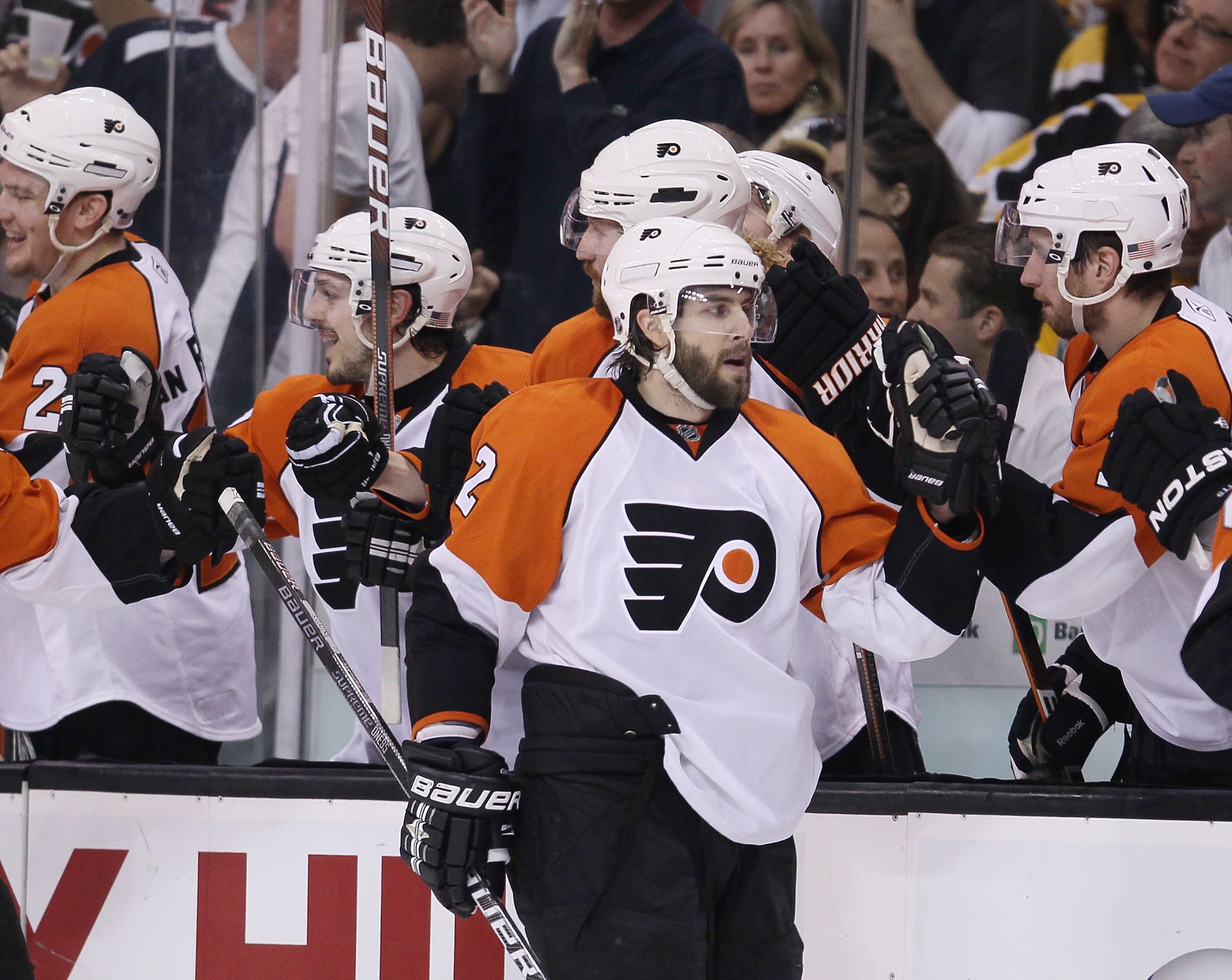 BOSTON - MAY 14:  Simon Gagne #12 of the Philadelphia Flyers is congratulated by teammates on the bench after he scored the game winning goal in the third period against the Boston Celtics in Game Seven of the Eastern Conference Semifinals during the 2010