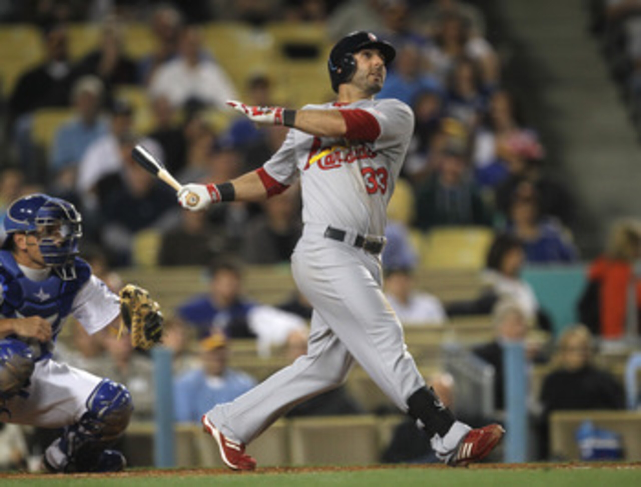 LOS ANGELES - APRIL 14: Daniel Descalso #33 of the St Louis Cardinals hits a sacrifice fly to bat in the Cardinals' second run in the second inning against the Los Angeles Dodgers on April 14, 2011 at Dodger Stadium in Los Angeles, California.  (Photo by 