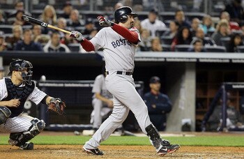 NEW YORK, NY - MAY 14:  Adrian Gonzalez #28 of the Boston Red Sox follows through on a seventh inning three run home run against the New York Yankees on May 14, 2011 at Yankee Stadium in the Bronx borough of New York City.  (Photo by Jim McIsaac/Getty Ima