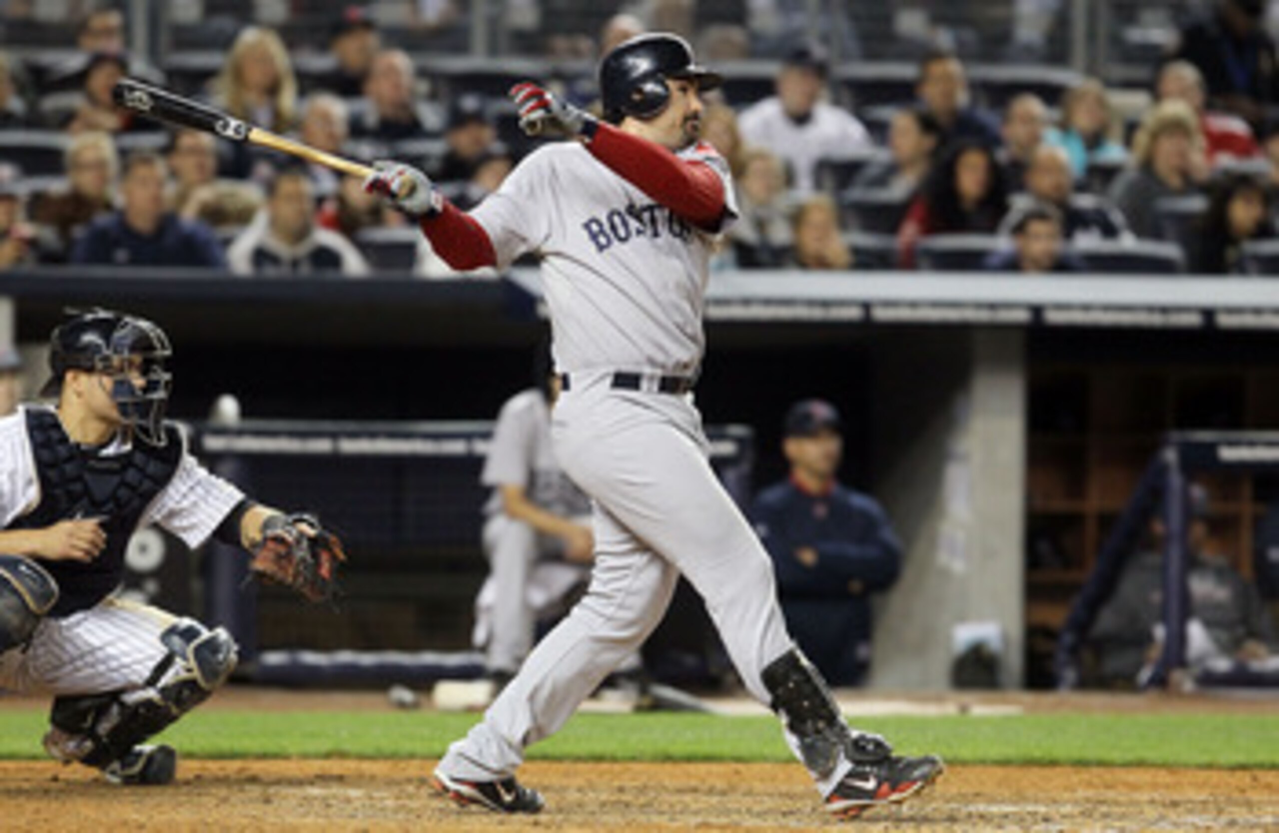 NEW YORK, NY - MAY 14: Adrian Gonzalez #28 of the Boston Red Sox follows through on a seventh inning three run home run against the New York Yankees on May 14, 2011 at Yankee Stadium in the Bronx borough of New York City. (Photo by Jim McIsaac/Getty Ima NEW YORK, NY - MAY 14: Adrian Gonzalez #28 of the Boston Red Sox follows through on a seventh inning three run home run against the New York Yankees on May 14, 2011 at Yankee Stadium in the Bronx borough of New York City. (Photo by Jim McIsaac/Getty Ima