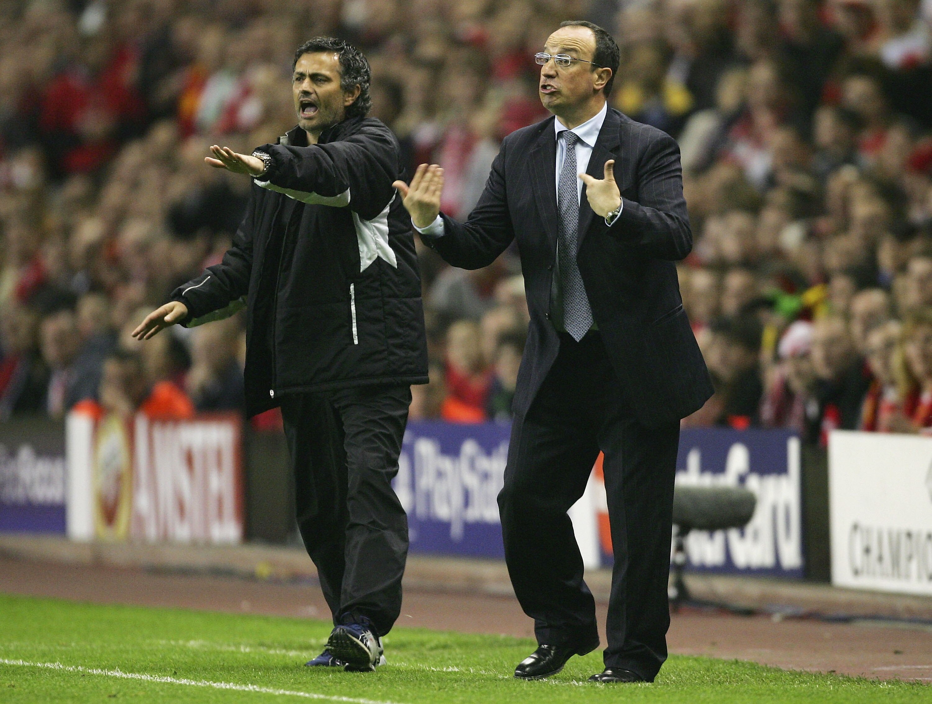 LIVERPOOL, ENGLAND - MAY 3:  Jose Mourinho the manager of Chelsea and Rafael Benitez the manager of Liverpool shout instructions to their players during the Champions League semi final second leg match between Liverpool and Chelsea at Anfield on May 3, 20