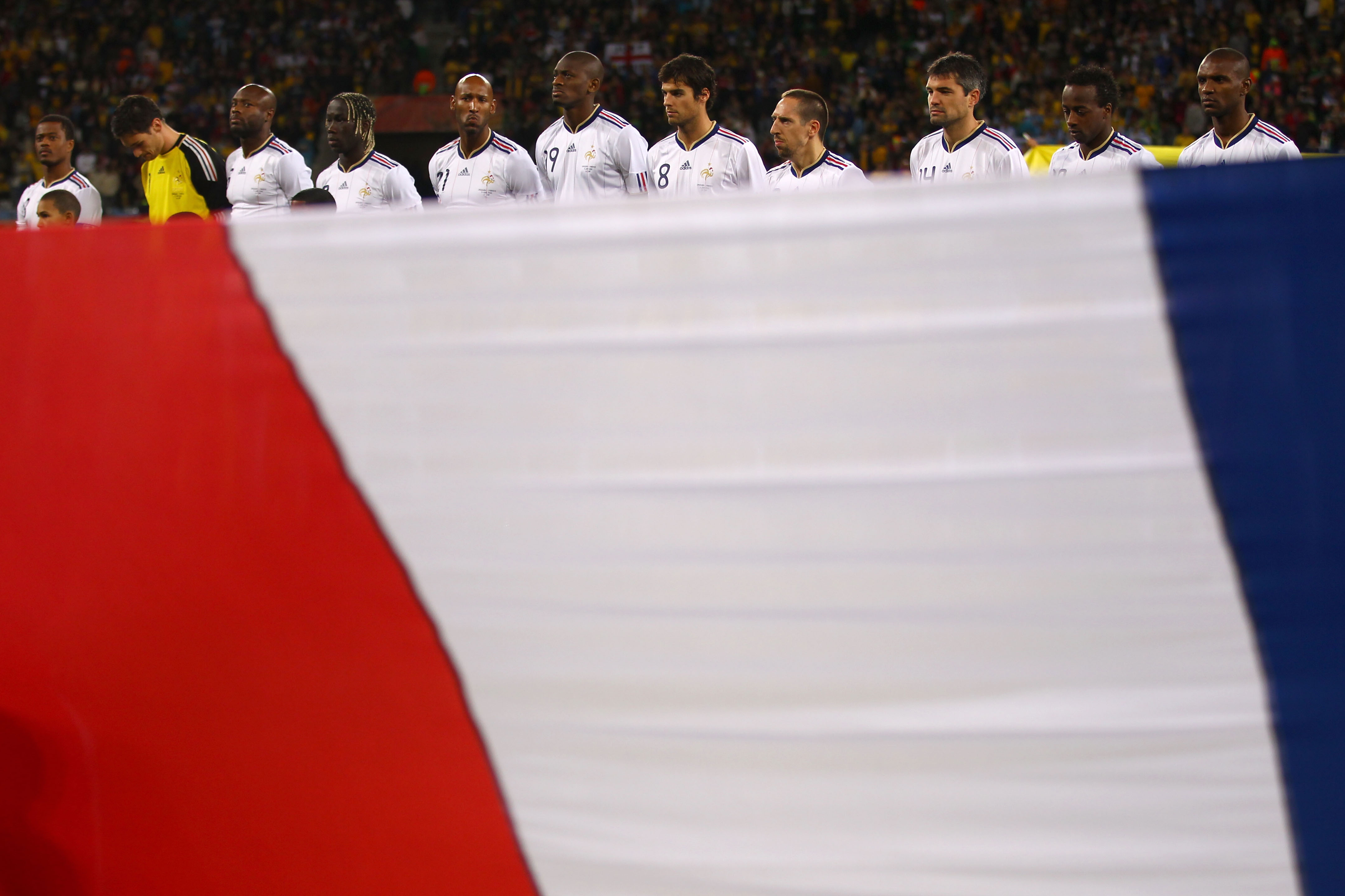 CAPE TOWN, SOUTH AFRICA - JUNE 11:  The France team lines up for the national anthems prior to the 2010 FIFA World Cup South Africa Group A match between Uruguay and France at Green Point Stadium on June 11, 2010 in Cape Town, South Africa.  (Photo by Lar