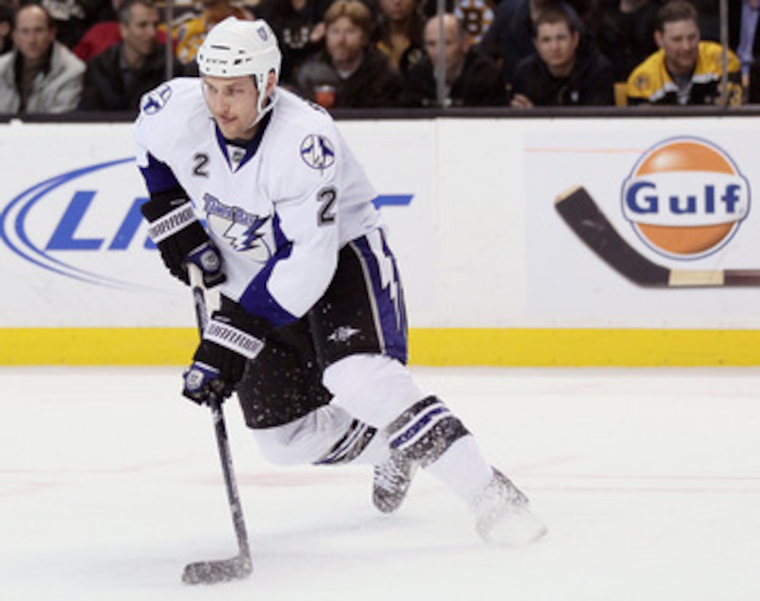 BOSTON, MA - MARCH 03:  Eric Brewer #2 of the Tampa Bay Lightning takes the puck in the third period against the Boston Bruins on March 3, 2011 at the TD Garden in Boston, Massachusetts. The Boston Bruins defeated the Tampa Bay Lightning 2-1.  (Photo by E
